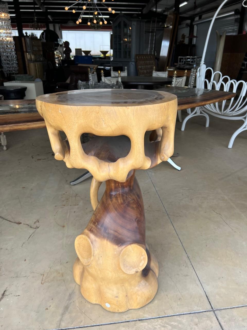 Beautiful and heavy truffle solid wood trunk pedestal and can also be use as side table.

A truffle trunk pedestal is a luxury furniture piece made of hand-carved solid wood trunk with a glossy finish light and dark walnut finish. It can be used