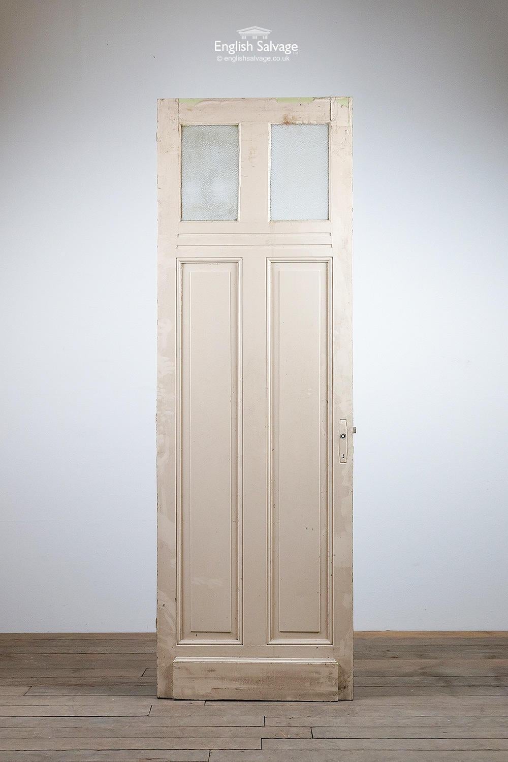 Salvaged tall two glazed panel pine door from France. One of several reclaimed from the same property. Oak veneer finish to the one side, the other is painted cream. Kickboards both sides. Few scuffs and scratches, three hinges. The dimpled glass is