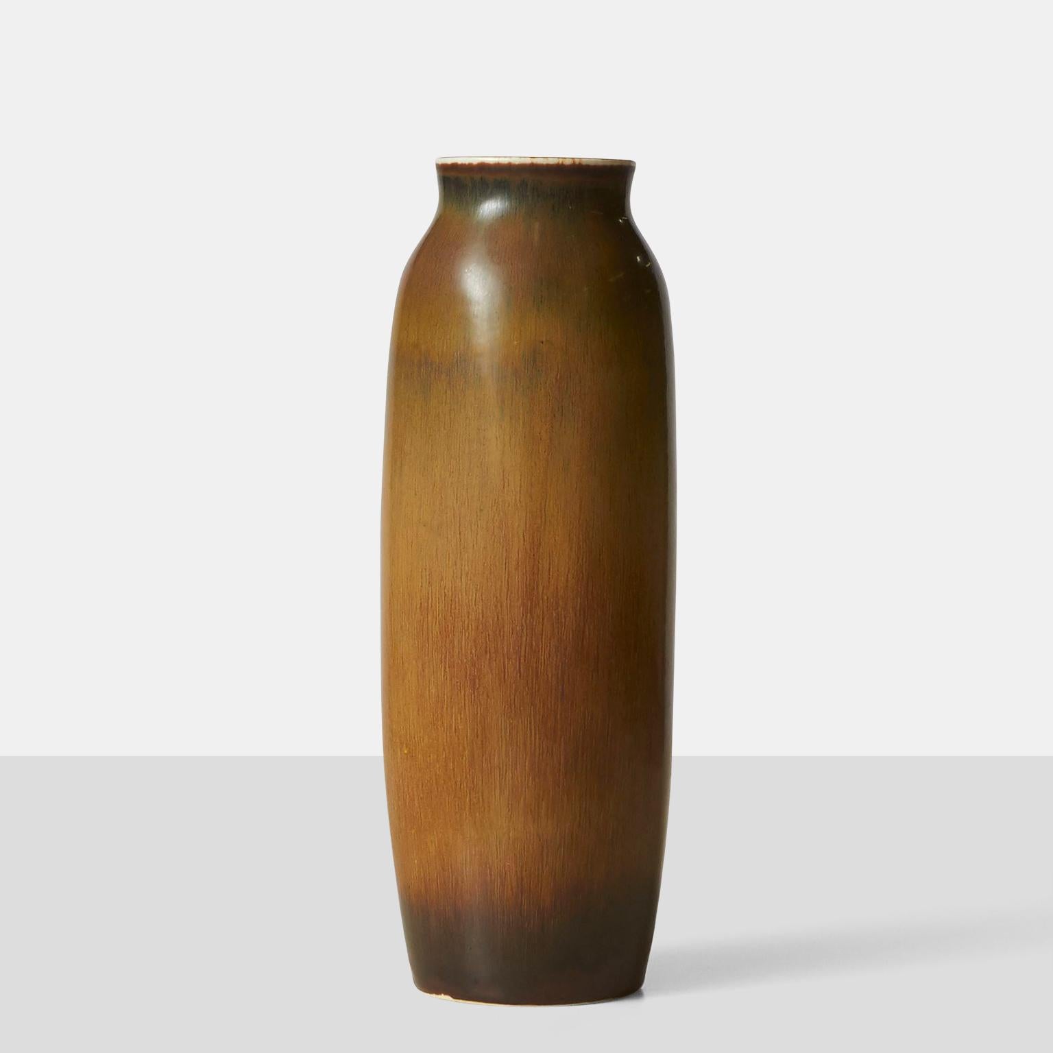 A Carl-Harry Stalhane vase in hare's fur glaze of tans and cinnamon. Crafted by Rörstrand in the 1960s, and inscribed by the artist.