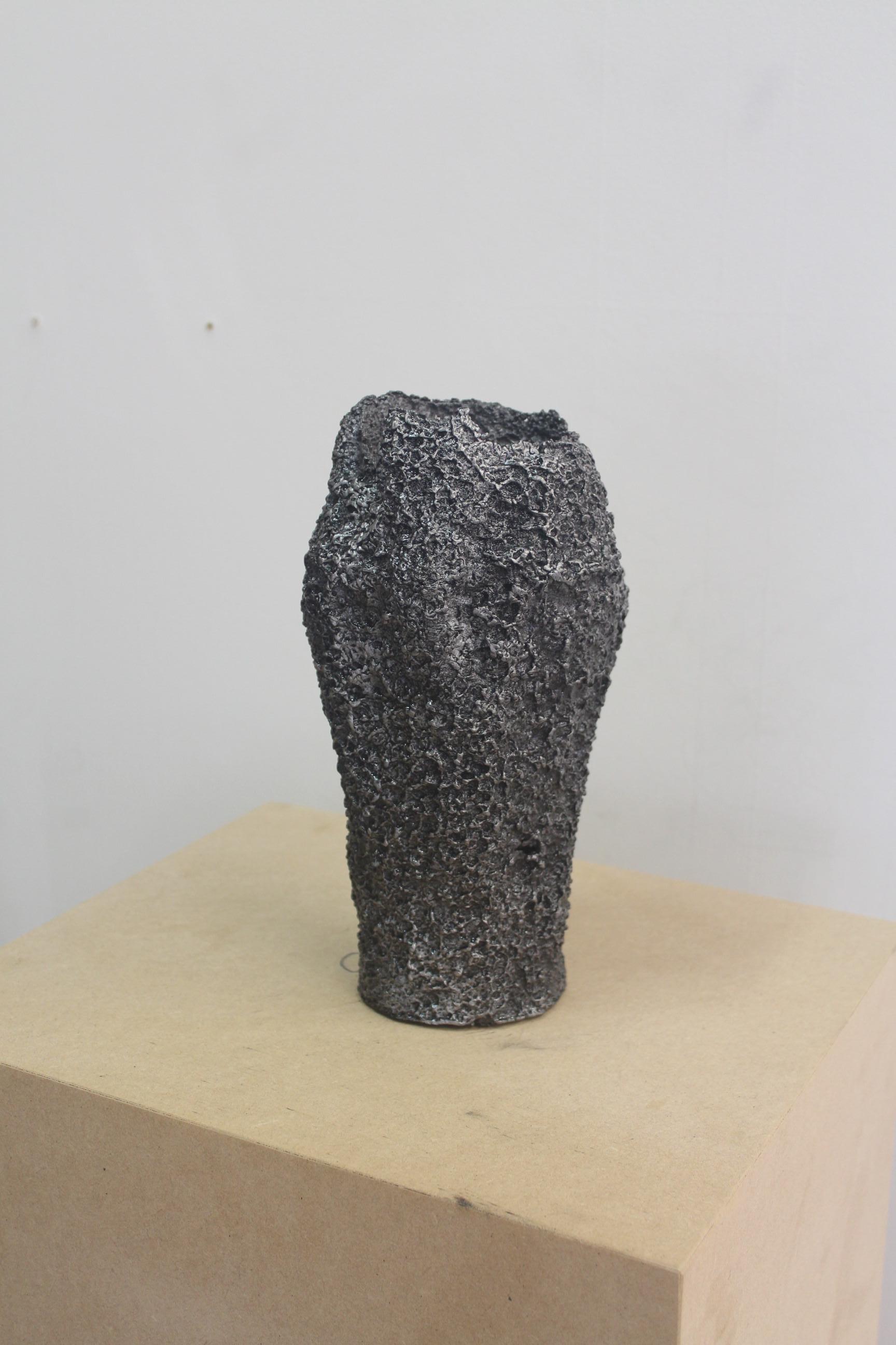 Tall Vessel Large by Saturday Yard Work
Dimensions: W 13 x D 13 x H 25 cm
Materials: Aluminium.
Finish: Blackened texture. 

SATURDAY YARD WORK by Nathan Martin is a Kaurna/Adelaide based practice that aims to find a medium between sculpture, craft,