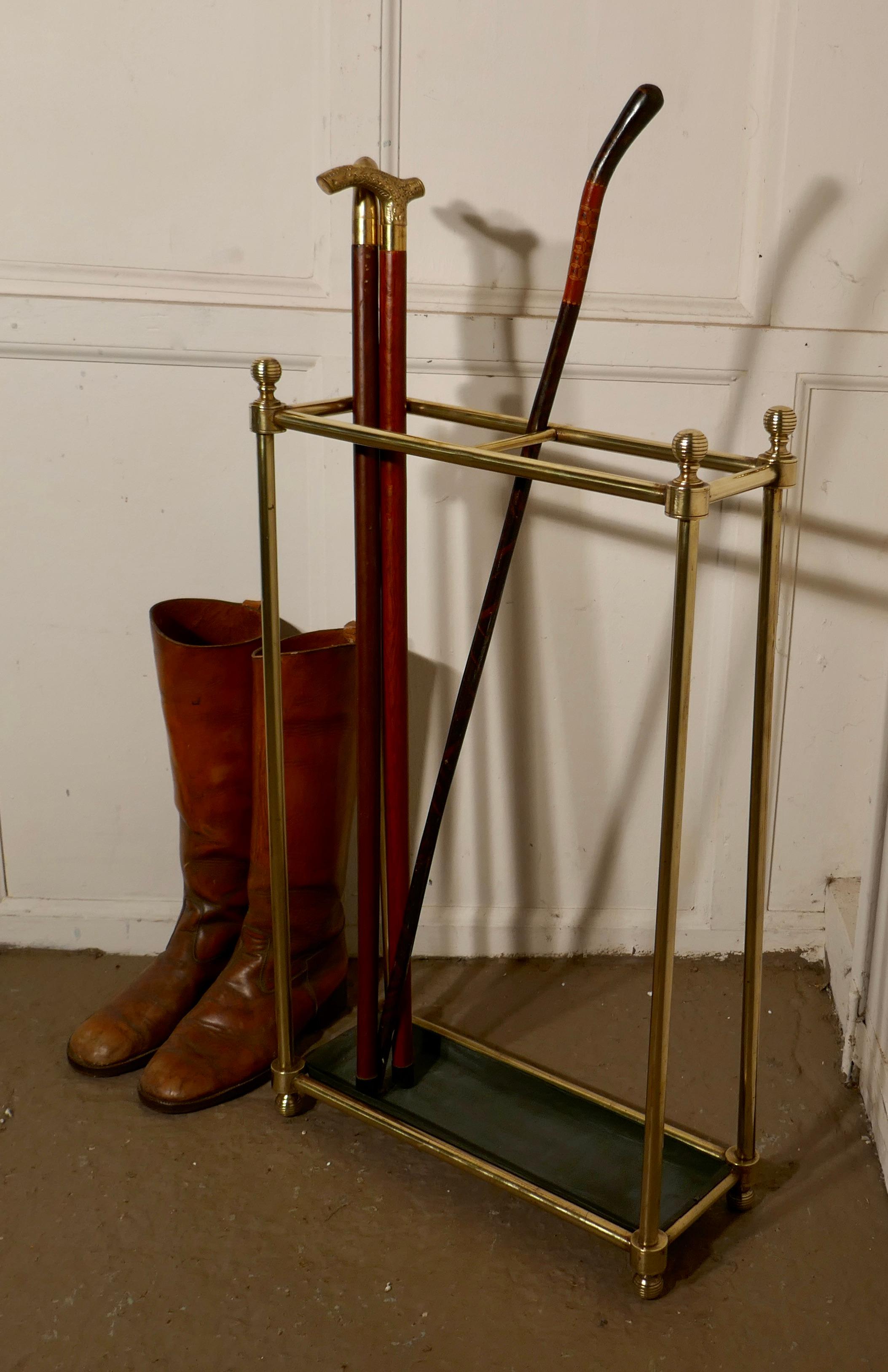Tall Victorian brass, and iron walking stick stand or umbrella stand

A charming piece, the stand has a brass top divided into 2 large sections, to hold either walking sticks and umbrellas
The stand is in very good condition and taller then