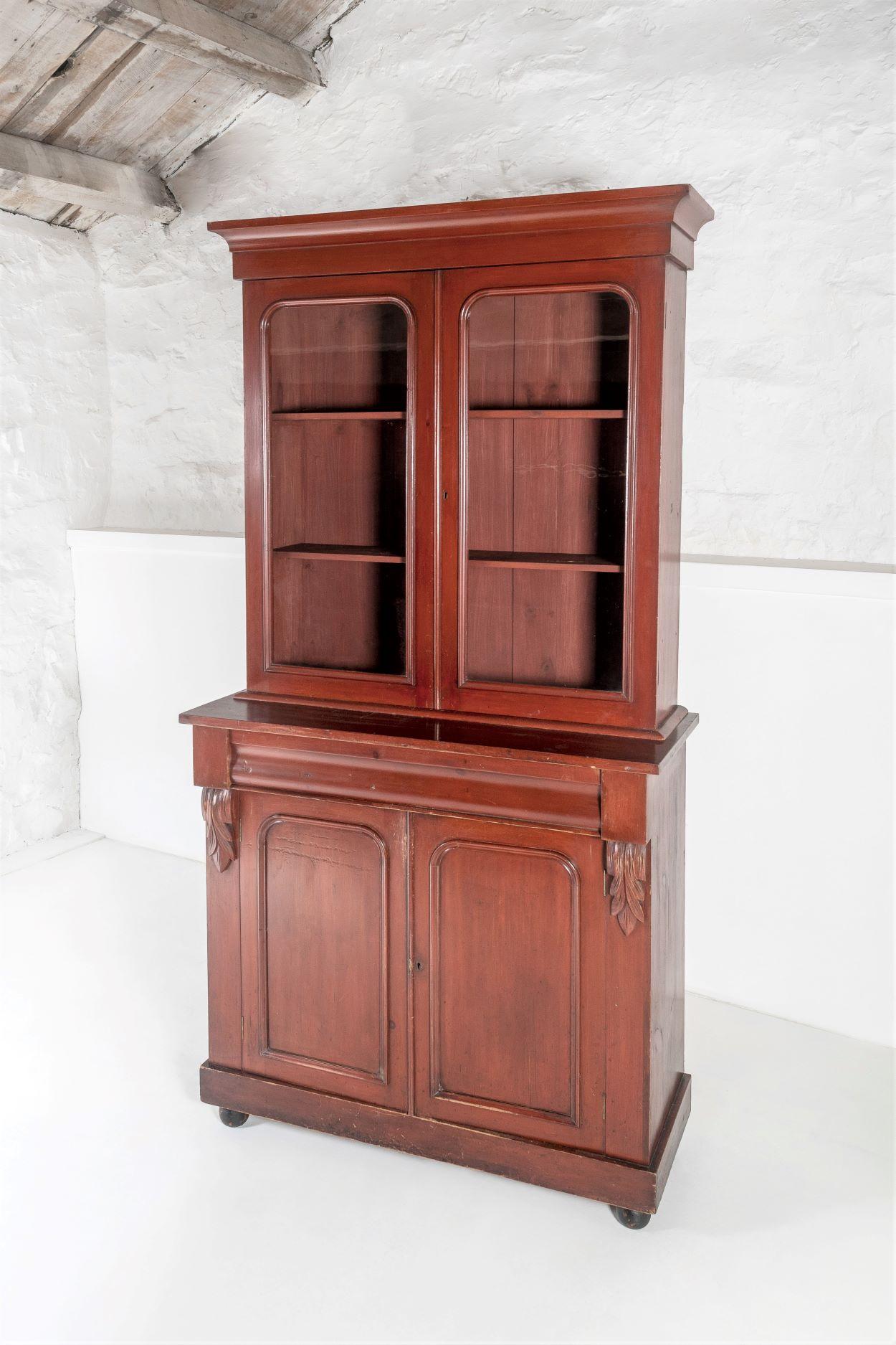 A characterful tall Victorian dresser unit boasting its original glazing and beautiful red brown lacquer.  An original piece is very good order, featuring some nice detailing.
The moulded ogee cornice gives the piece a good balance and height, the