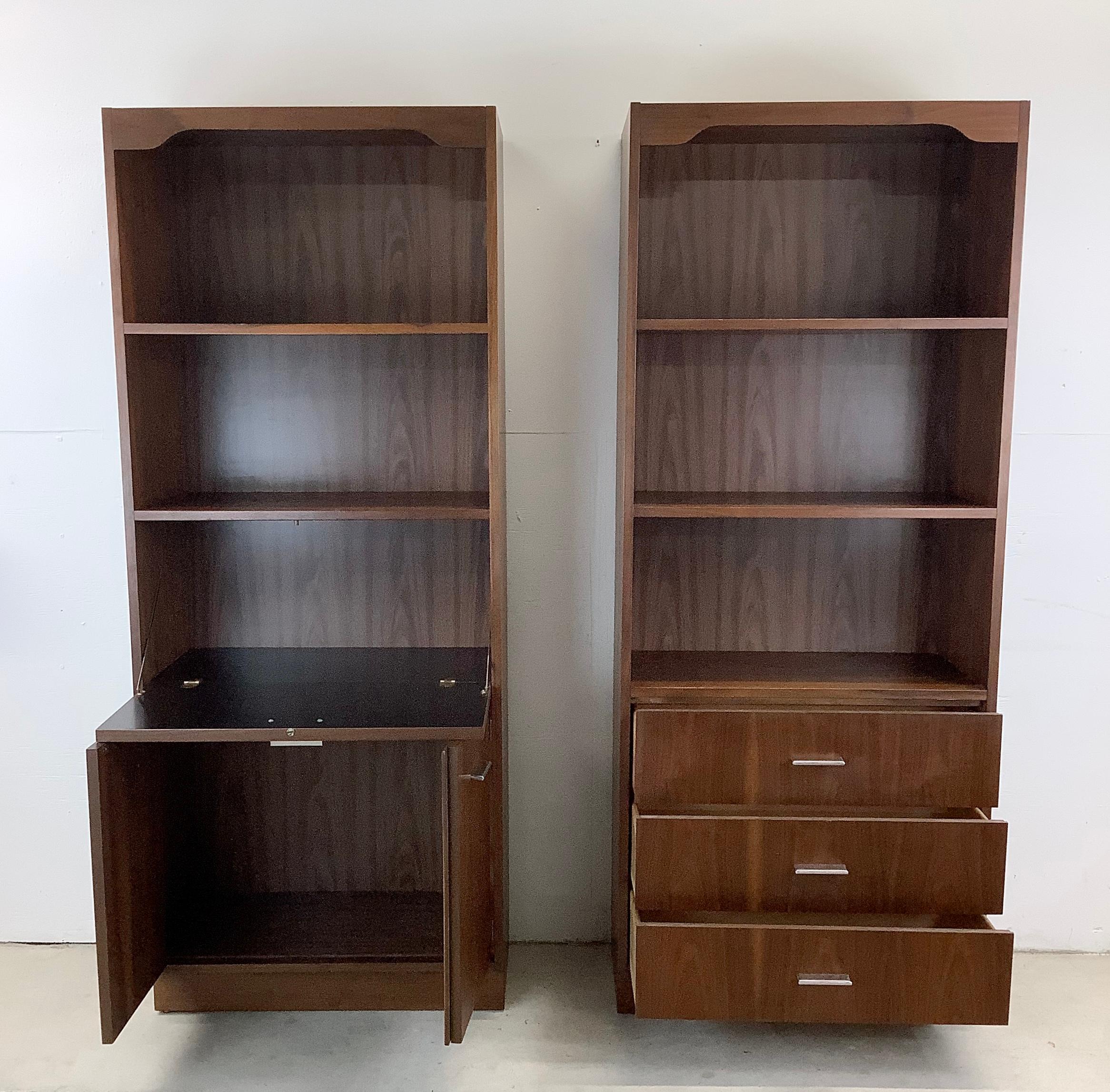 Introducing this striking Pair of Tall Vintage Bookcases – a stunning duo that combines functionality with timeless charm. Crafted with attention to detail and steeped in history, these cabinets are not just storage solutions but statement pieces