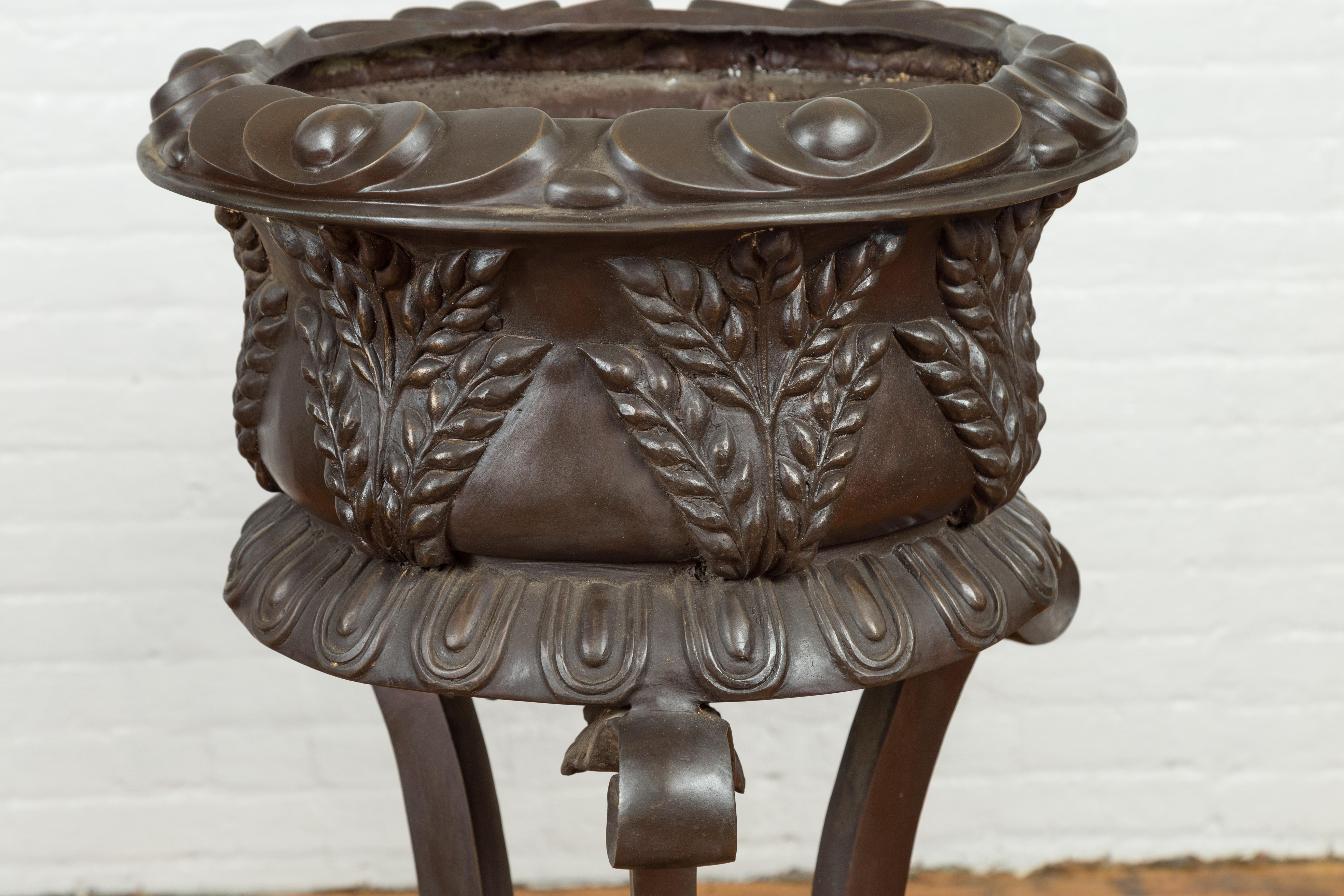20th Century Tall Vintage Bronze European Style Tripod Planter with Raised Floral Motifs For Sale