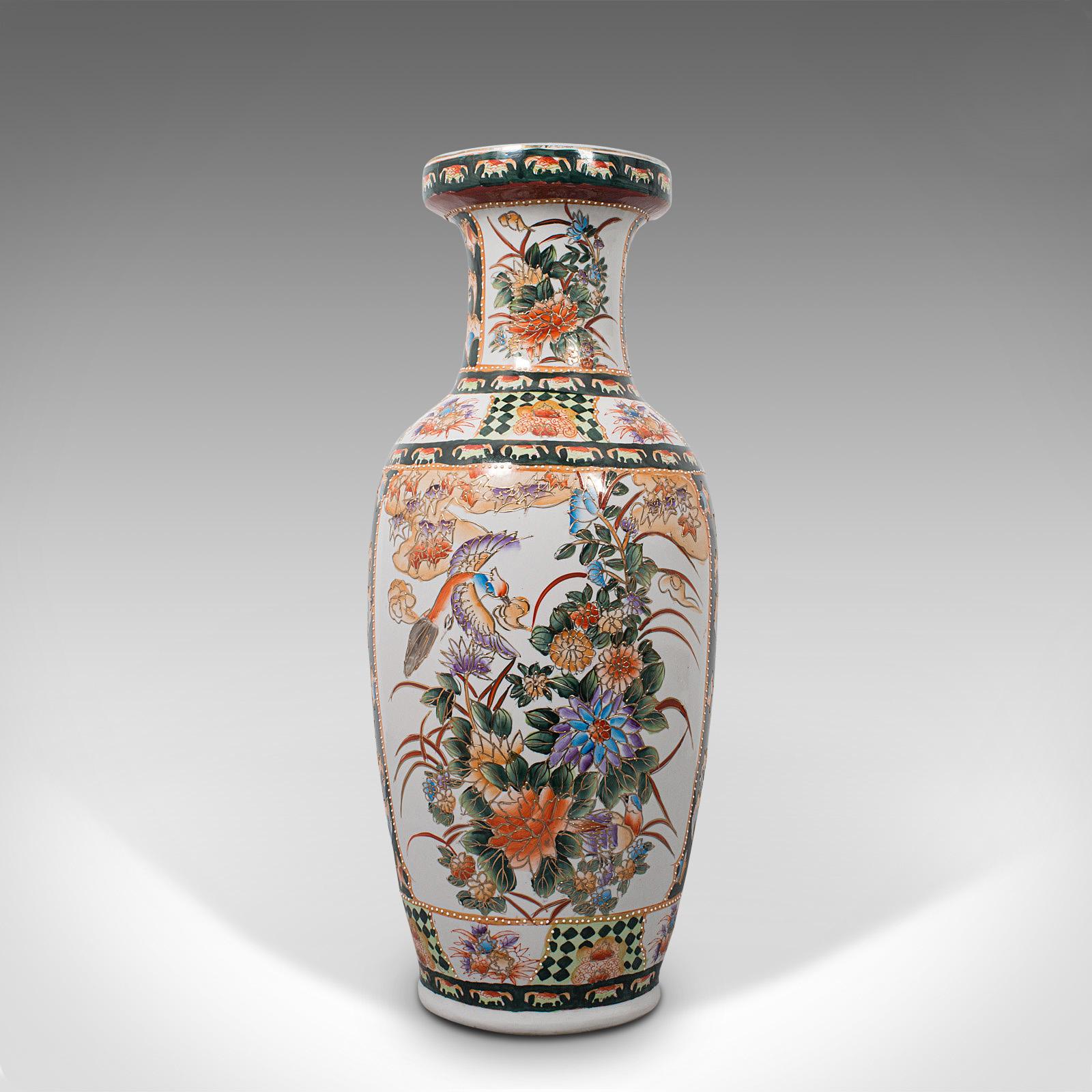 This is a tall vintage decorative flower vase. An Oriental, quality ceramic baluster urn with Art Deco taste, dating to the mid-20th century, circa 1940.

Appealingly colorful and of impressive proportion
Displaying a desirable aged