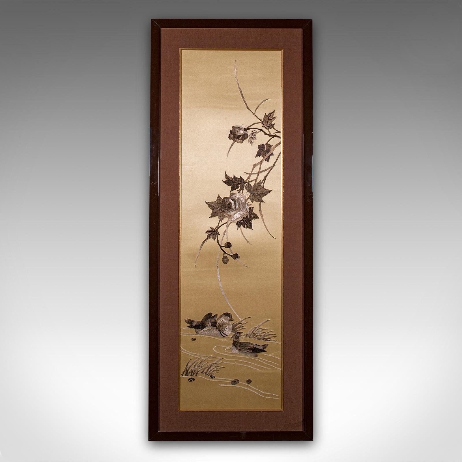 
This is a tall vintage decorative panel. A Chinese, framed silk cotton embroidered display, dating to the late 20th century, circa 1970.

Attractive golden tones to this charming panel
Displays a desirable aged patina and in good order
Quality