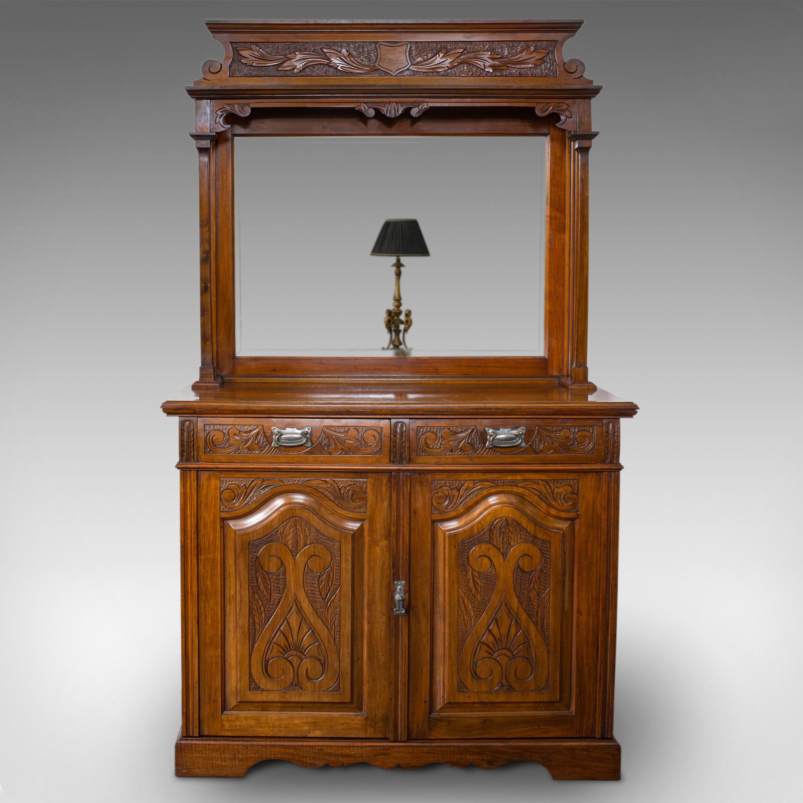 This is a tall vintage dresser. An English, walnut sideboard cabinet in Art Nouveau taste, dating to the late 20th century, circa 1980.

Generously sized with Art Nouveau overtones
Displays a desirable aged patina
Select walnut shows fine grain