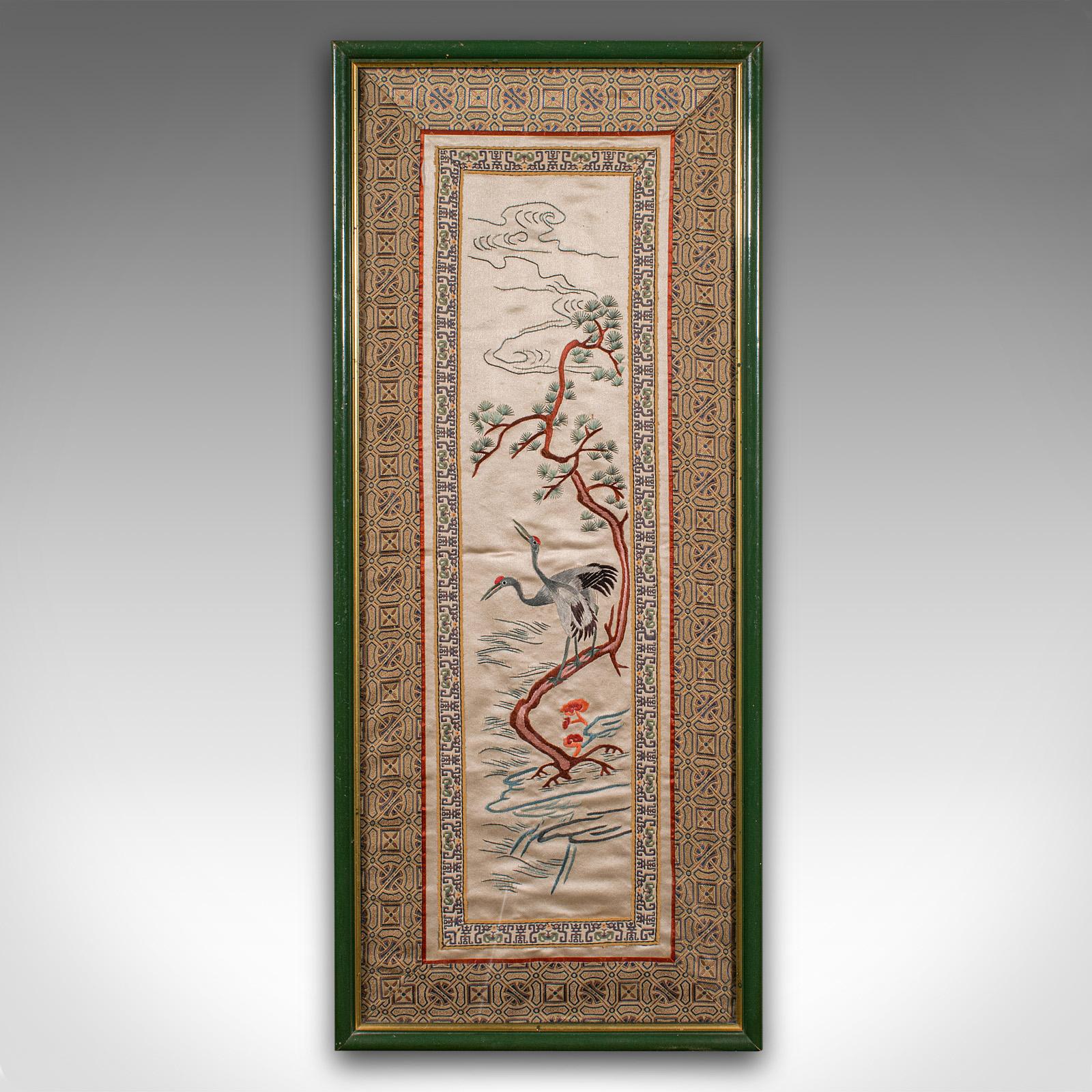 This is a tall vintage embroidered panel. An Oriental, silk cotton needlepoint scene, dating to the Art Deco period, circa 1930. A finely detailed textile, rich in Far Eastern decorative appeal.

Charming Oriental subject, with embroidered bird