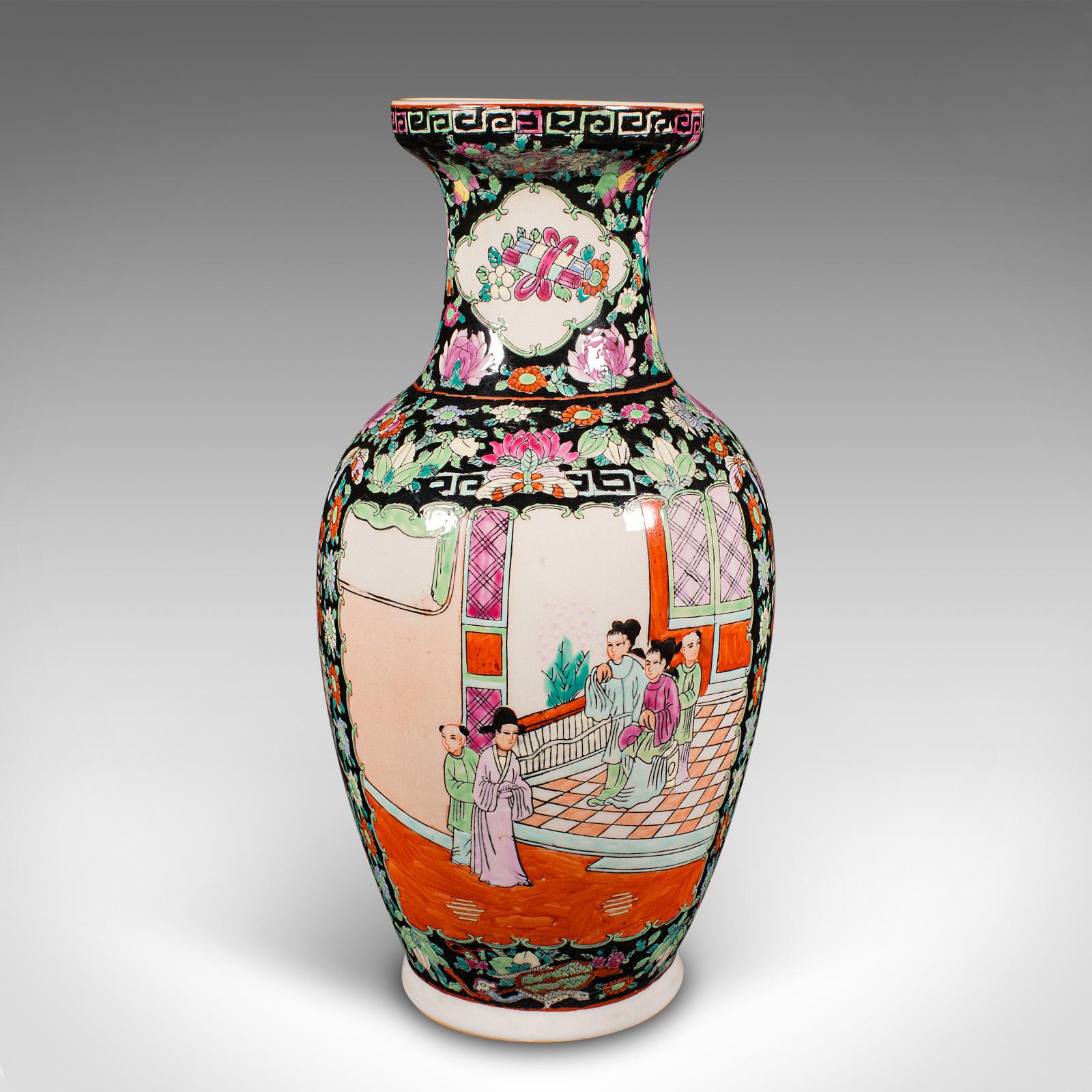 This is a tall vintage flower vase. A Chinese, ceramic display urn in Art Deco taste, dating to the mid 20th century, circa 1940.

Profusely decorated, capturing the Oriental Art Deco taste
Displays a desirable aged patina in good original