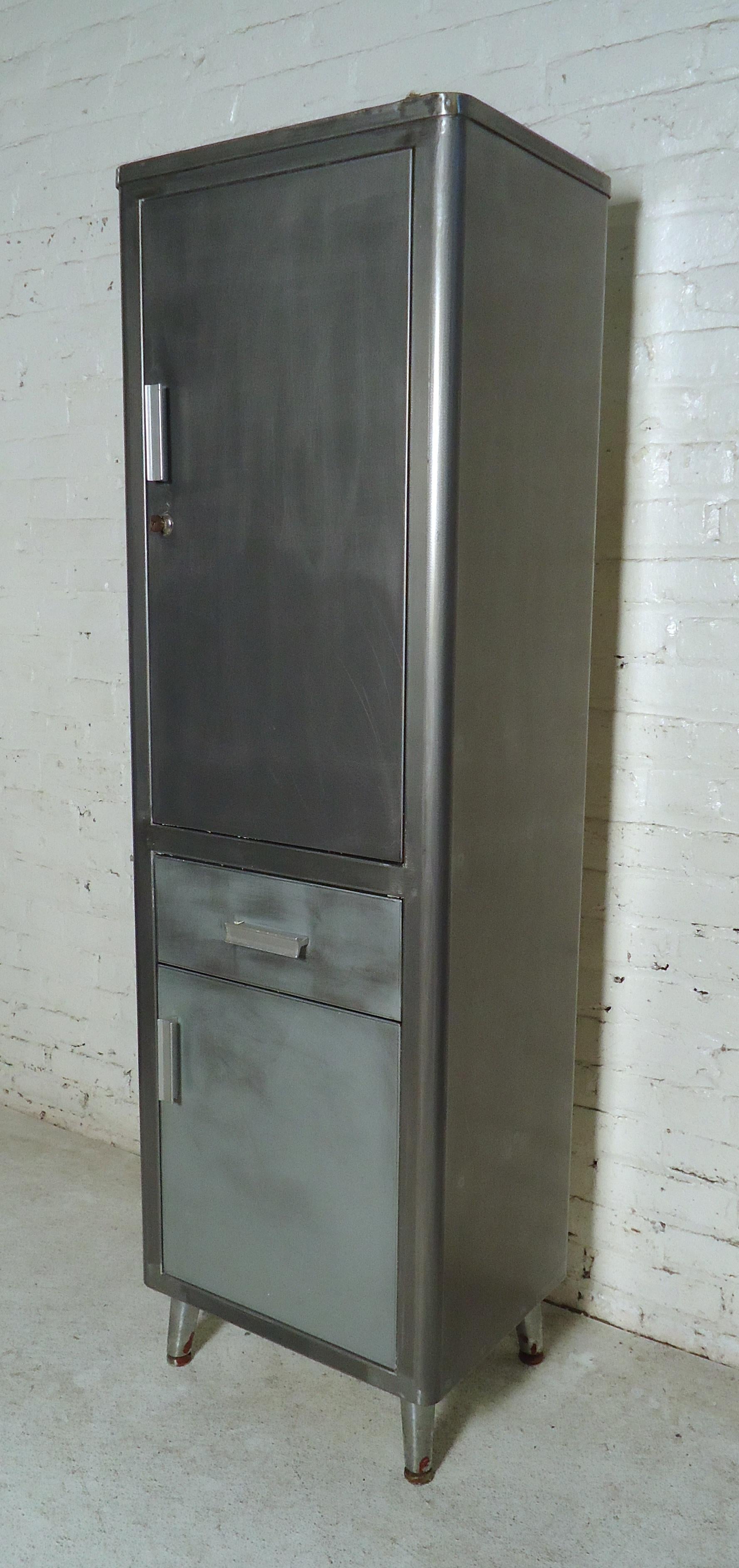 Unique industrial cabinet featuring one drawer and two spacious storage cabinets with removable shelves.

(Please confirm item location - NY or NJ - with dealer).