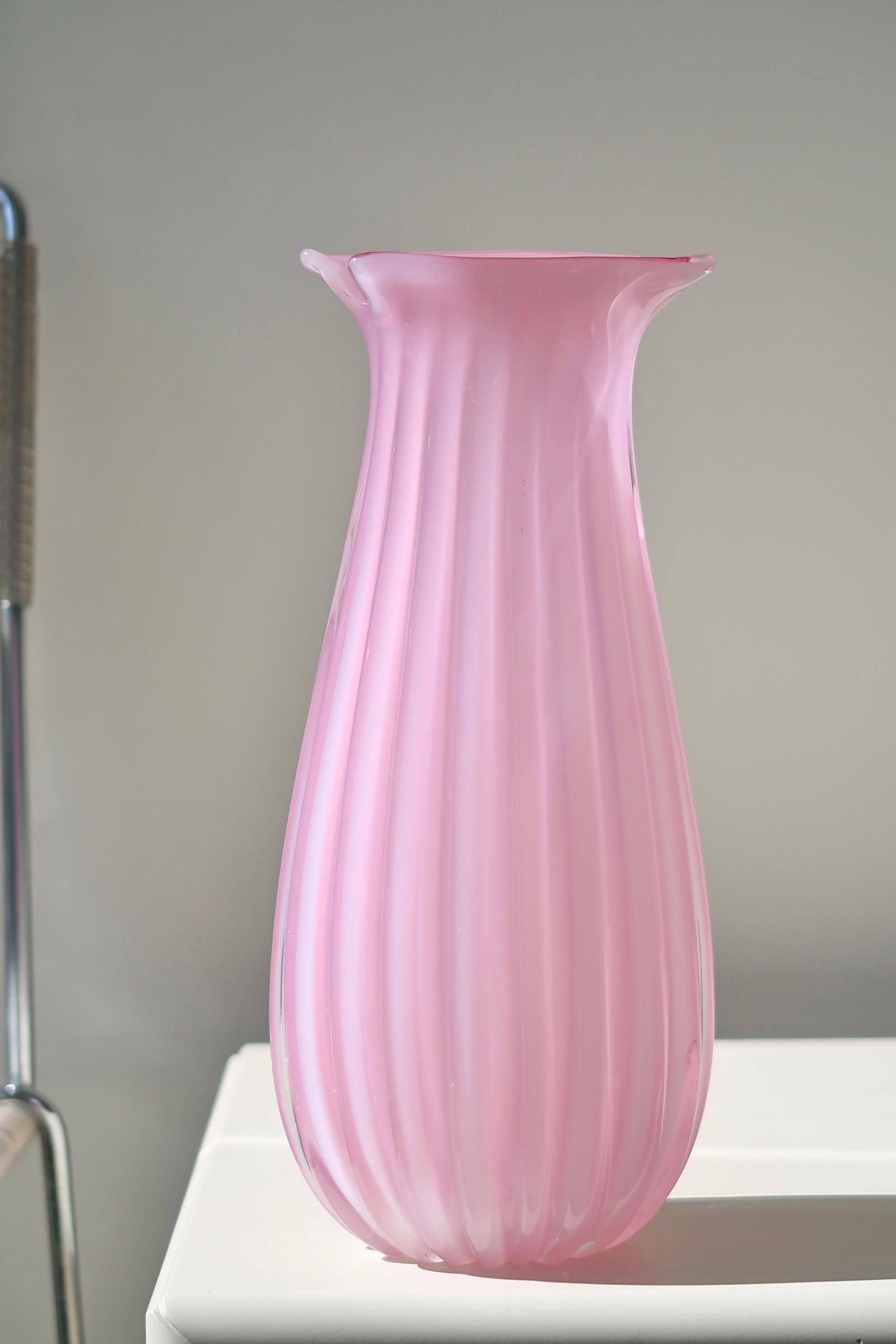 Large vintage Murano glass vase. The vase is mouth-blown in light pink / pink alabaster glass, which has a very special depth in daylight. This type of glass has become a collector's item due to its rarity and the absolutely stunning shade. Handmade