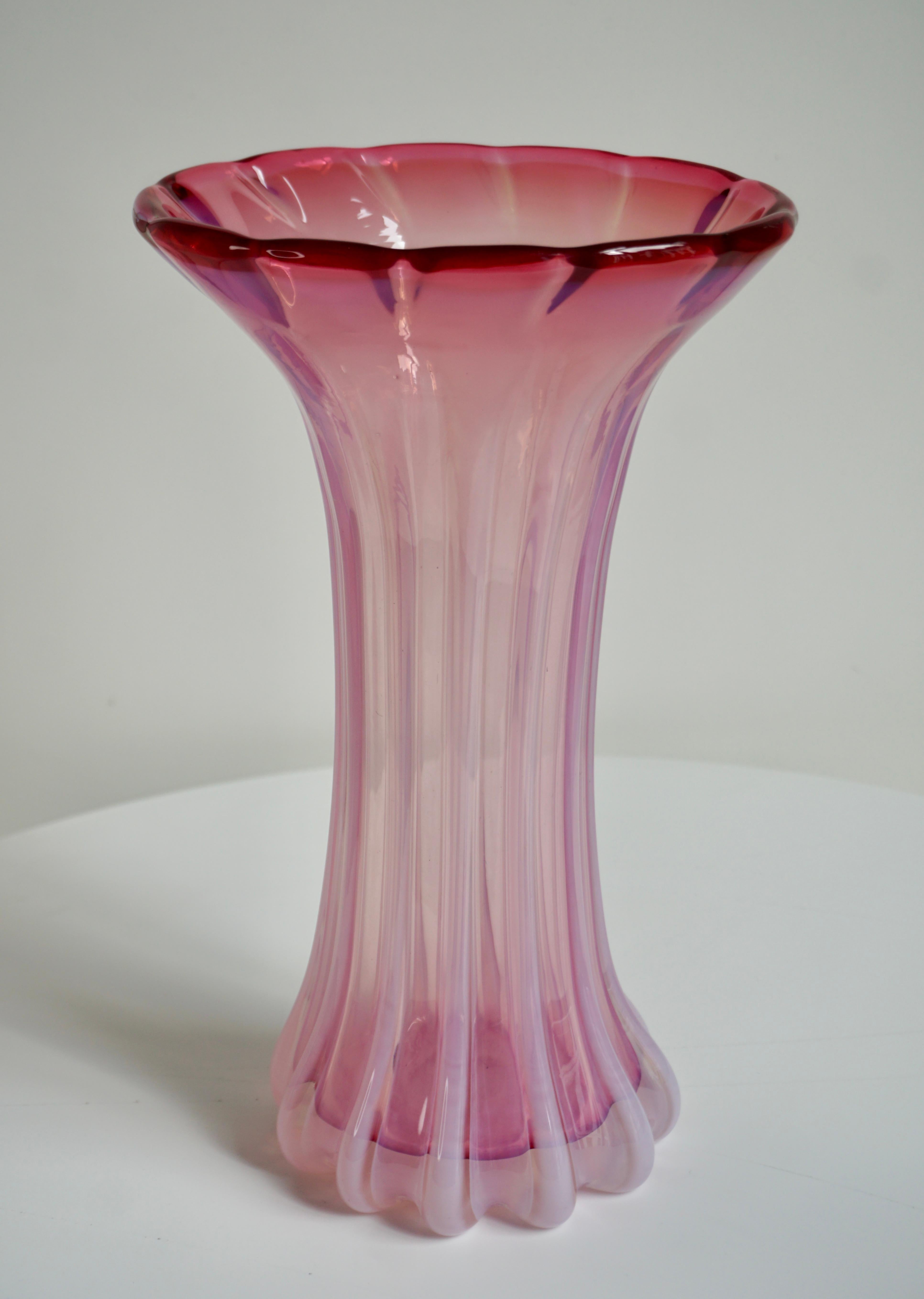 Large vintage Murano glass vase. 

The vase is mouth-blown in light pink / pink glass, which has a very special depth in daylight. This type of glass has become a collector's item due to its rarity and the absolutely stunning shade.
Handmade in