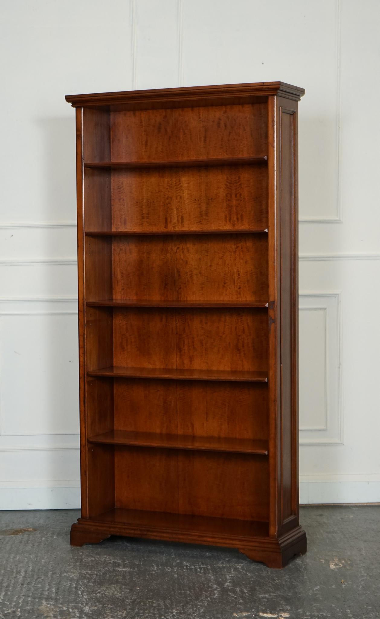 
We are delighted to offer for sale this Tall Vintage Open Solid Wood Bookcase. 

This bookcase features a classic design that highlights the natural beauty of the wood grain. Standing elegantly, it offers ample vertical storage with multiple