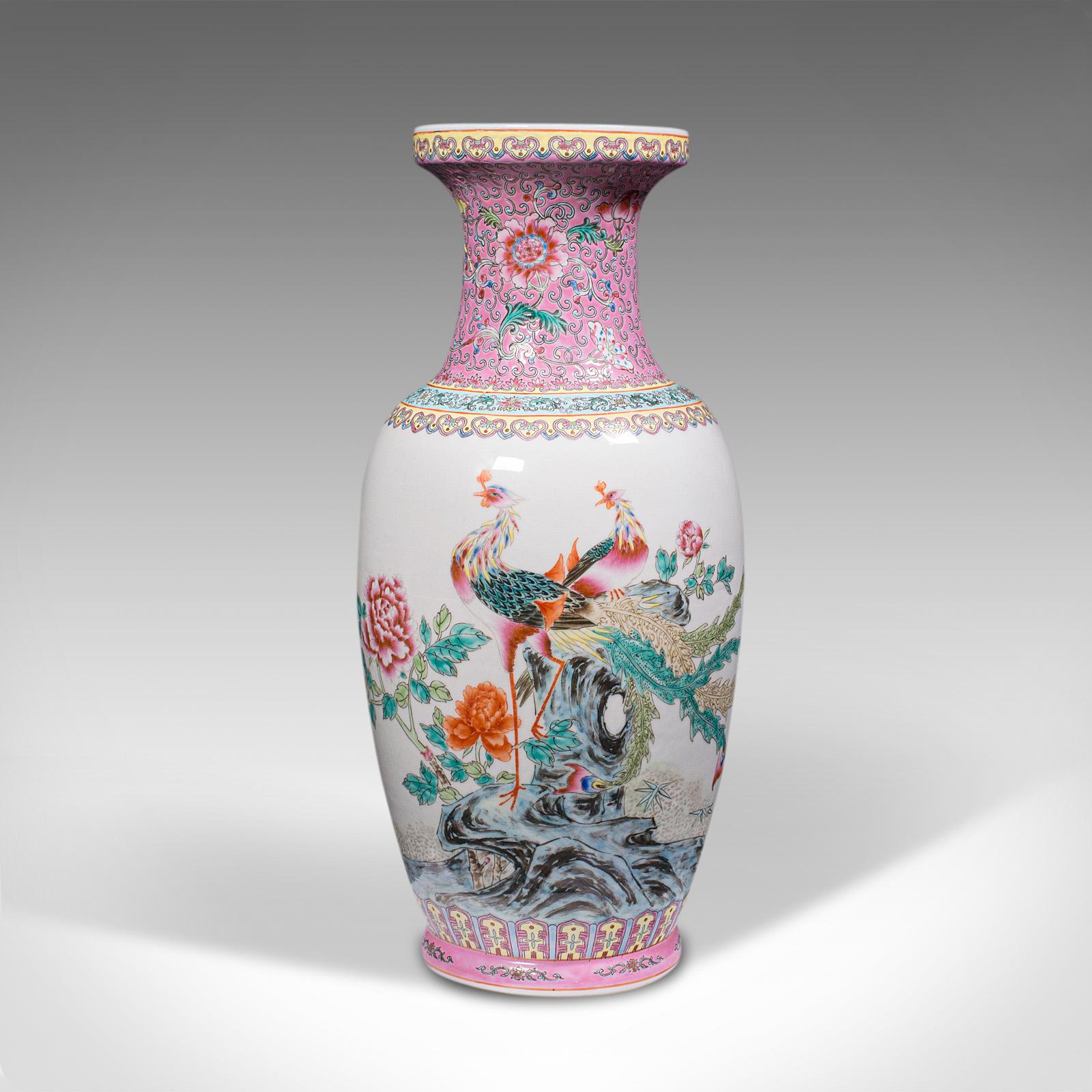 This is a tall vintage peacock vase. A Chinese, ceramic baluster urn with Art deco taste, dating to the mid 20th century, circa 1940.

Charmingly colourful, with generous proportion and form
Displays a desirable aged patina and in good