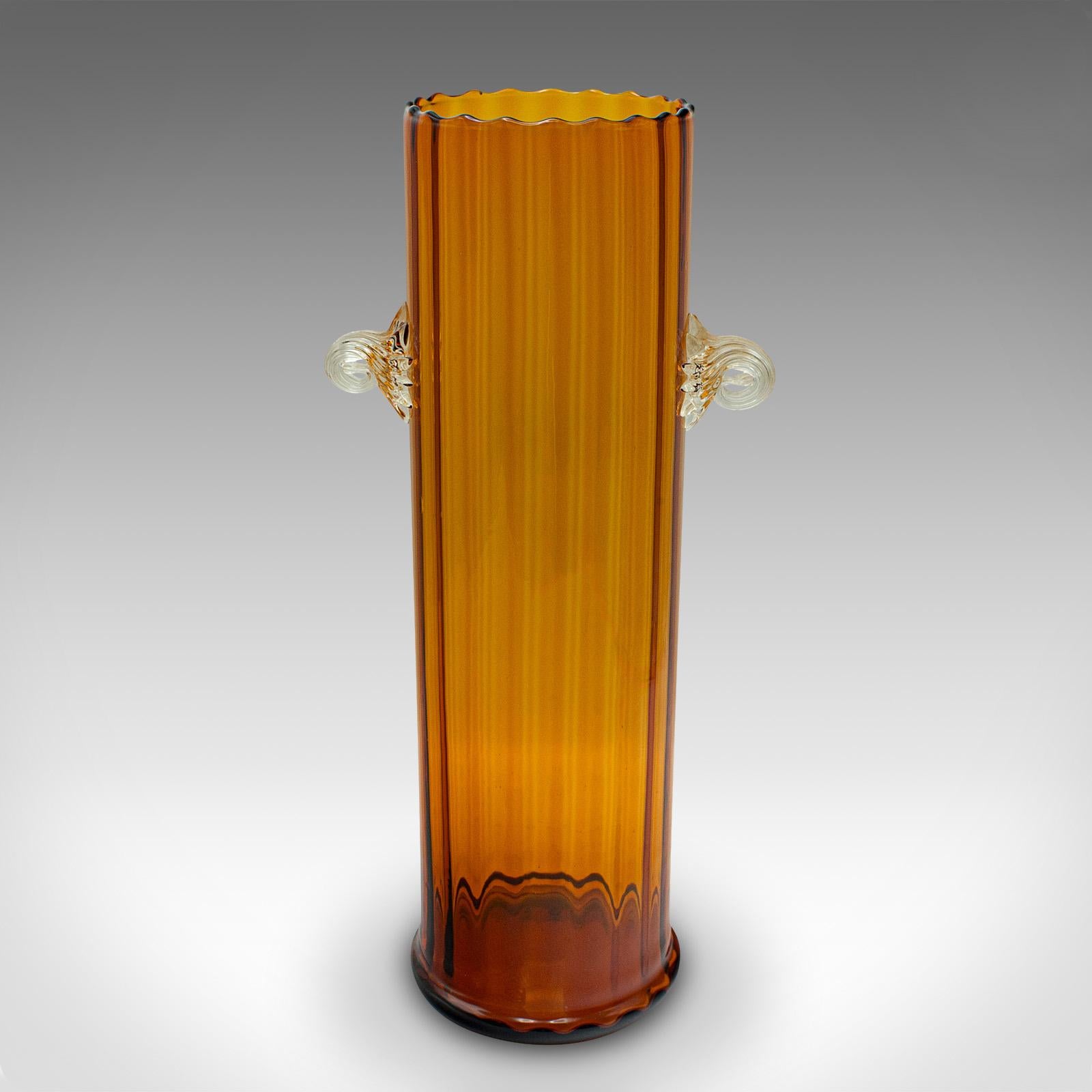 This is a tall vintage ribbed vase. A French, art glass flower sleeve, dating to the Art Deco period, circa 1930.

Graced with delightful colour and an eye-catching finish
Displays a desirable aged patina and in good order
Quality glass with ribbed