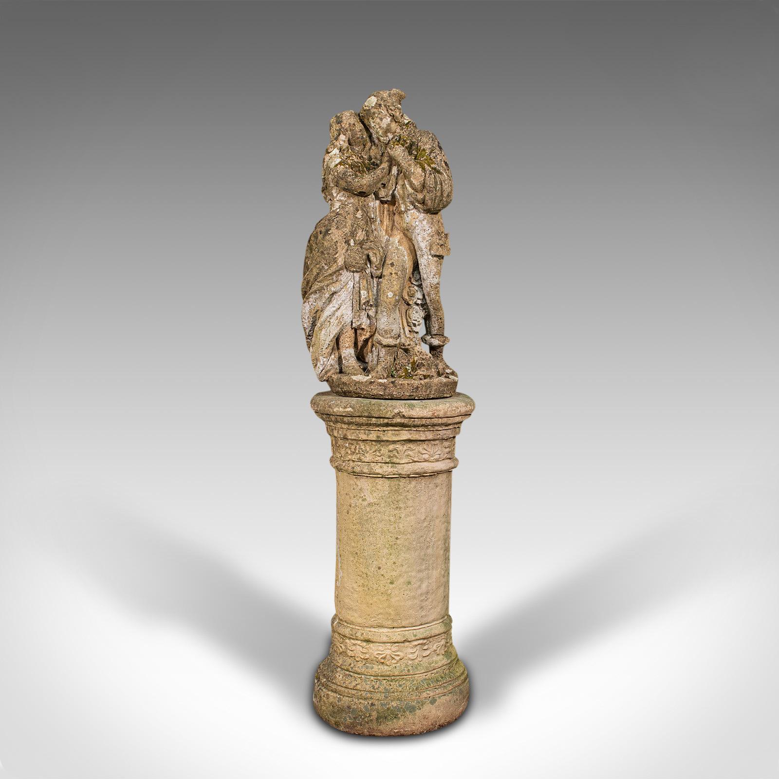 This is a tall vintage statue. An English, reconstituted stone sculpture of two romantic lovers atop a podium, dating to the mid 20th century, circa 1950.

Graced with decades of natural weathering
Displays a desirable aged patina
Reconstituted