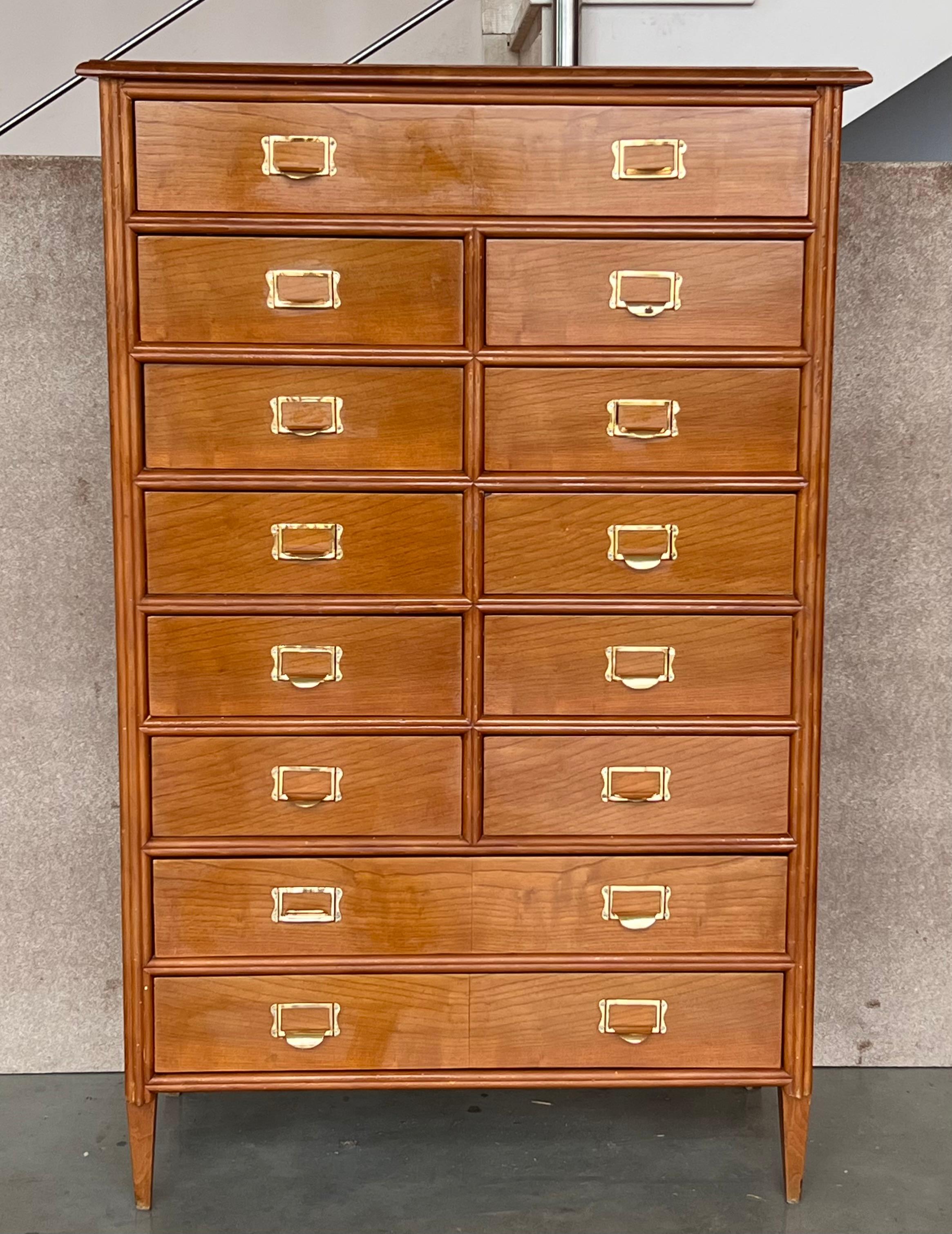 Tall Campaign chest that features Thirteen drawers with original brass hardware.