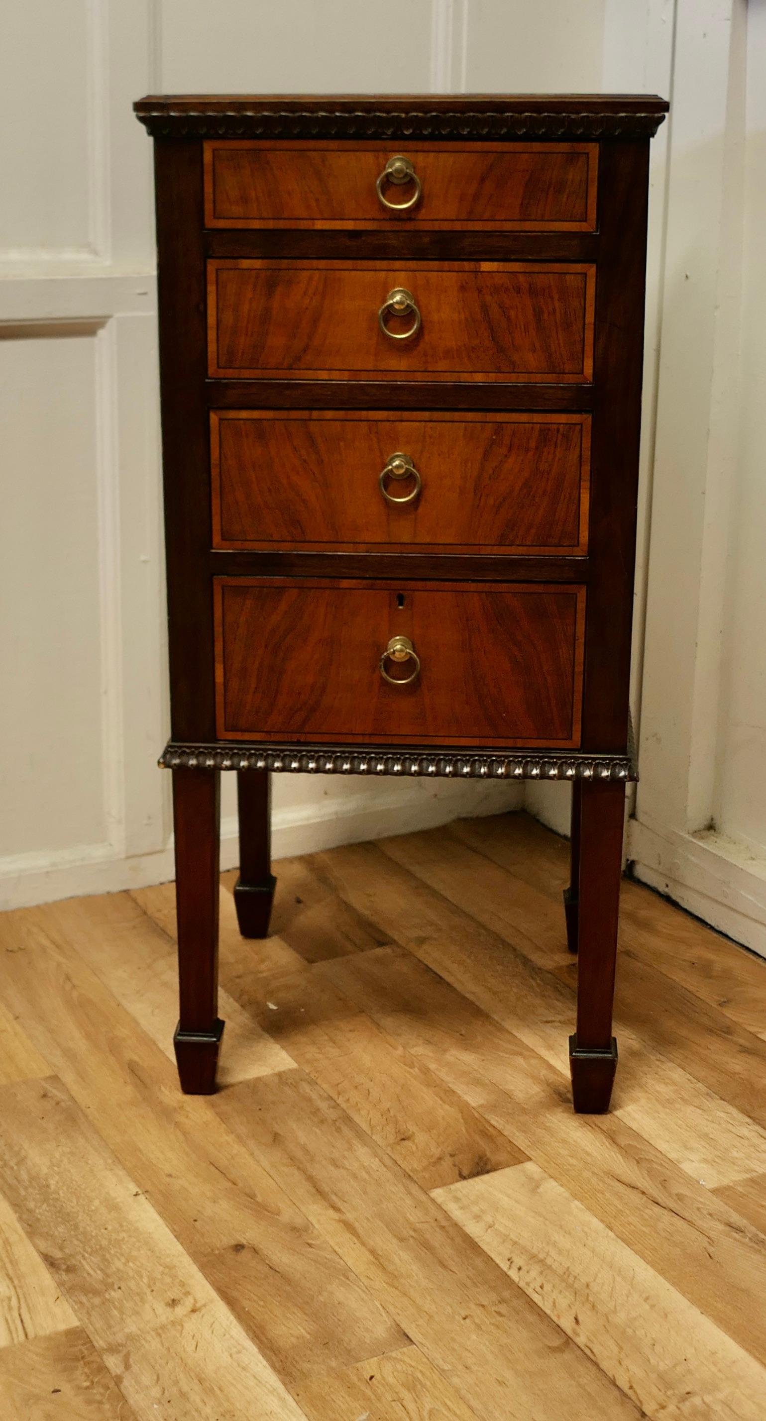 Tall walnut and satinwood chest of drawers 

The chest is set on slim legs it has 4 full width drawers and a little decorative carving
This is a a very attractive looking piece, the chest is made in Walnut with satinwood veneers on the front of