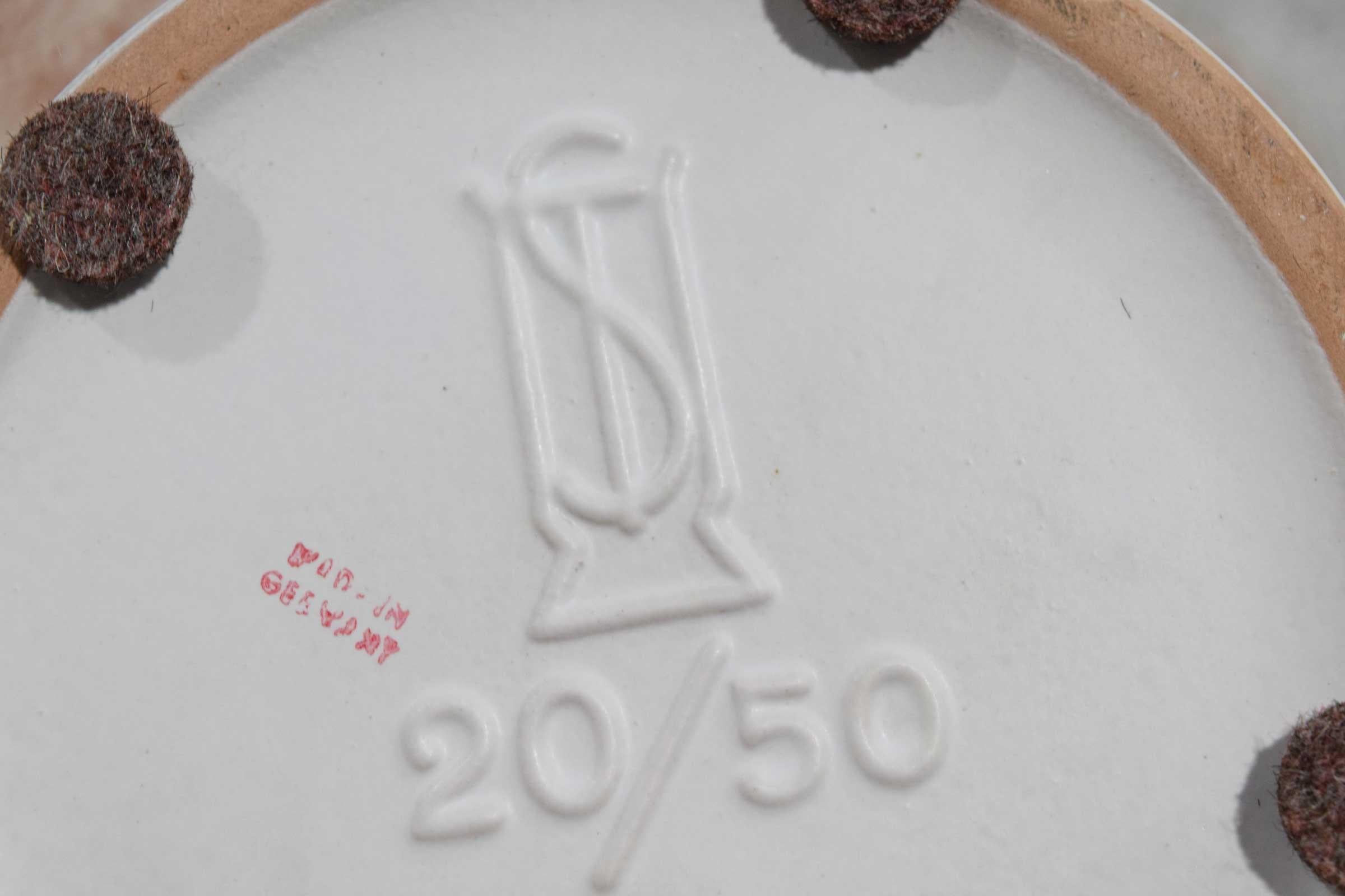 White ceramic with matte glaze.