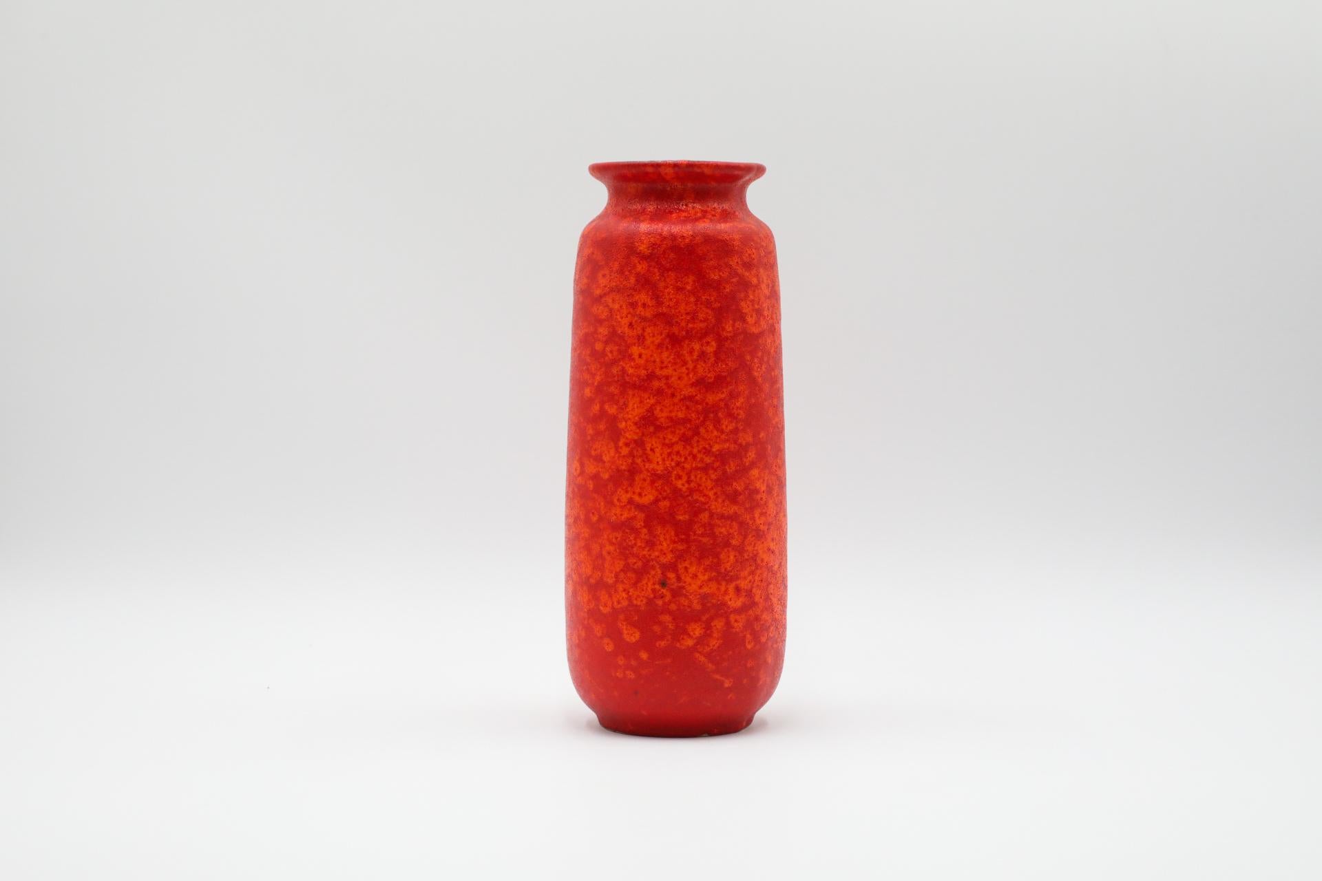 Tall West German Orange lava ceramic vase. In original condition with visible wear consistent with its age and use. Regarded as the golden age of ceramics, highly collectable 1950s-1970s Art Pottery is known for experimental and exploratory glazes,