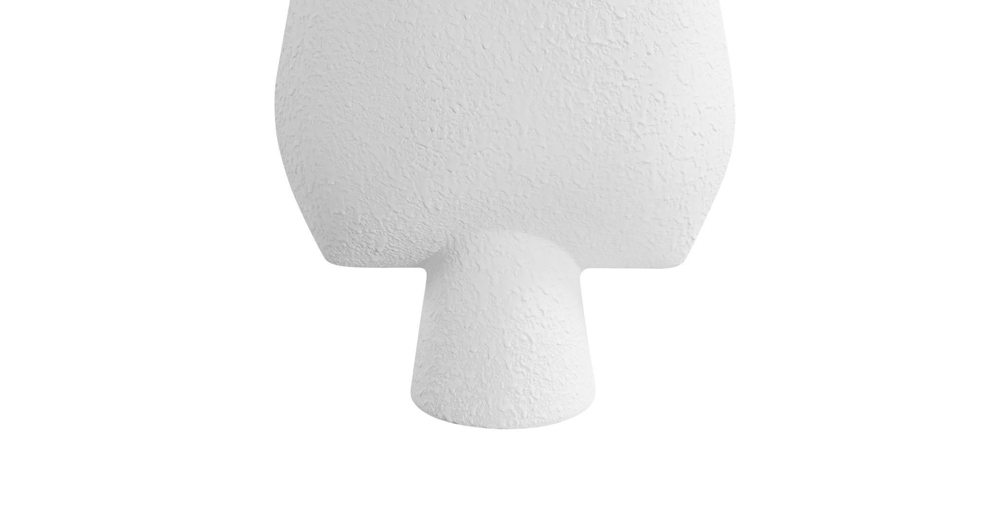 Contemporary Danish tall textured white ceramic vase. 
Arrow shaped top with tubular shaped base.
Also available in matte grey S5606.
Two available and sold individually.

 