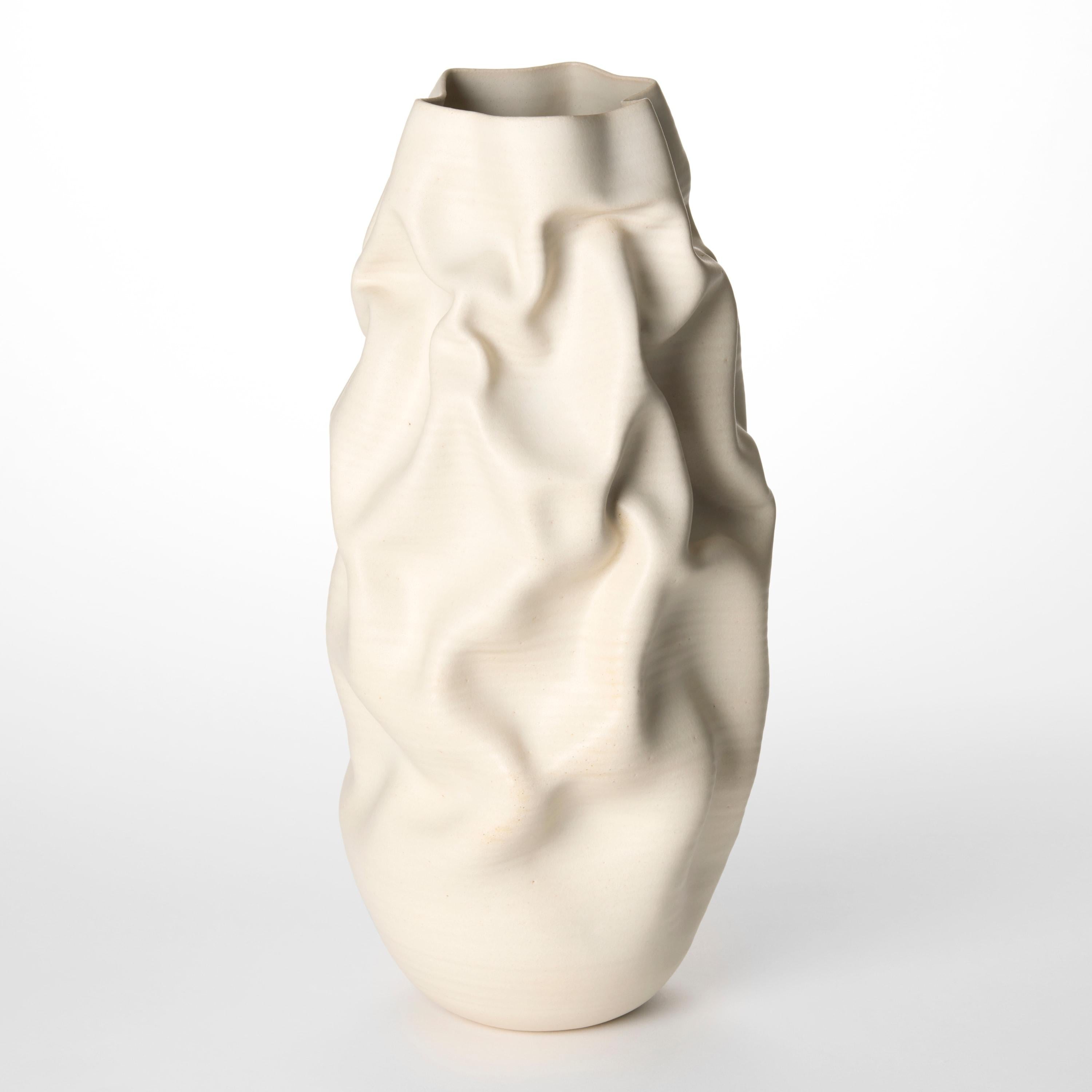 'Tall White Crumpled Form No 152’ is a unique sculptural vessel by the British artist, Nicholas Arroyave-Portela.

Nicholas Arroyave-Portela’s professional ceramic practice began in 1994. After 20 years based in London, he moved and set up his
