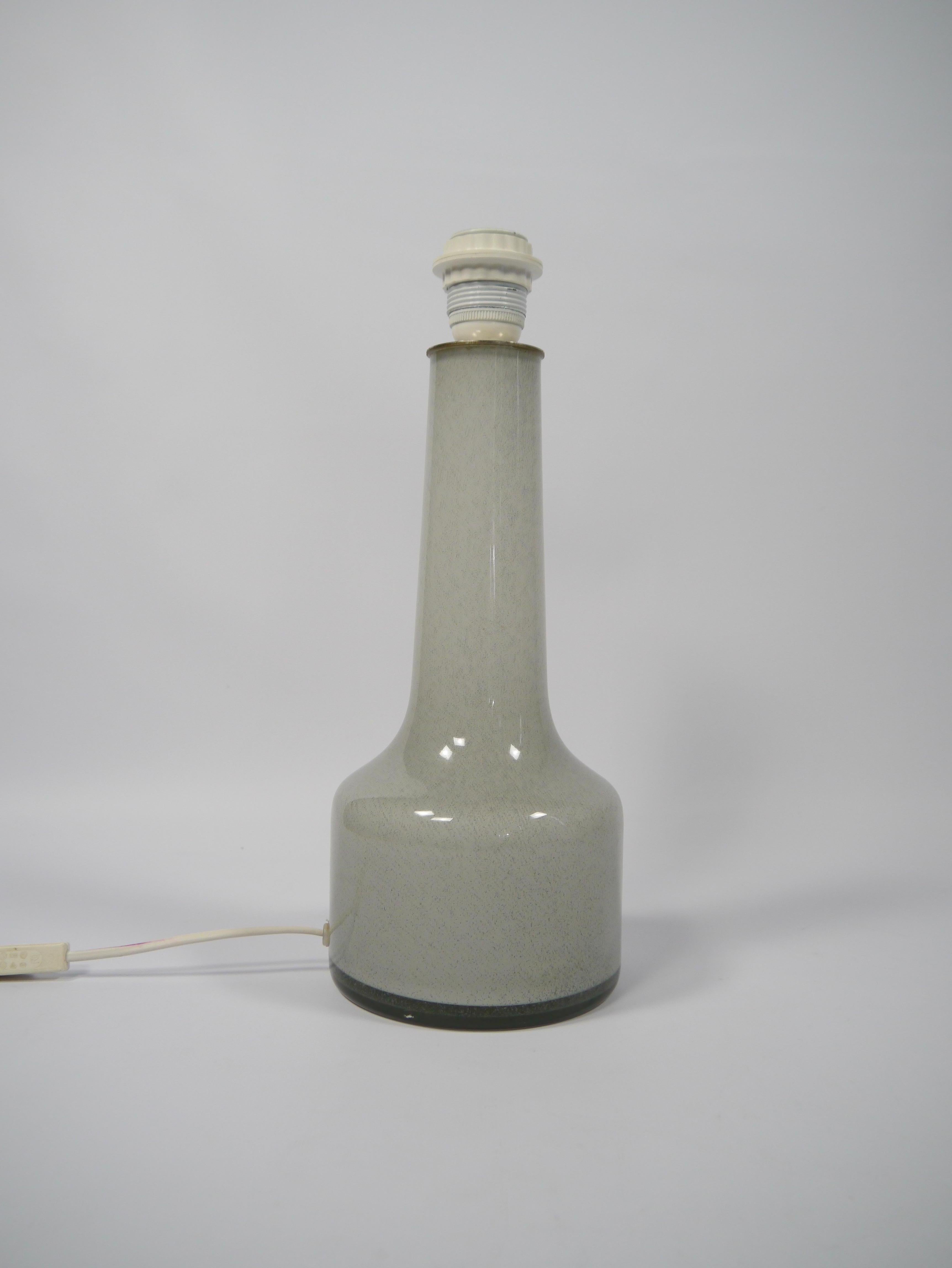 Tall white glass table lamp manufactured by Høvik Verk, Norway 1960s. Logo marked on top of nickel plate at the base of bulb / lampshade holder. 