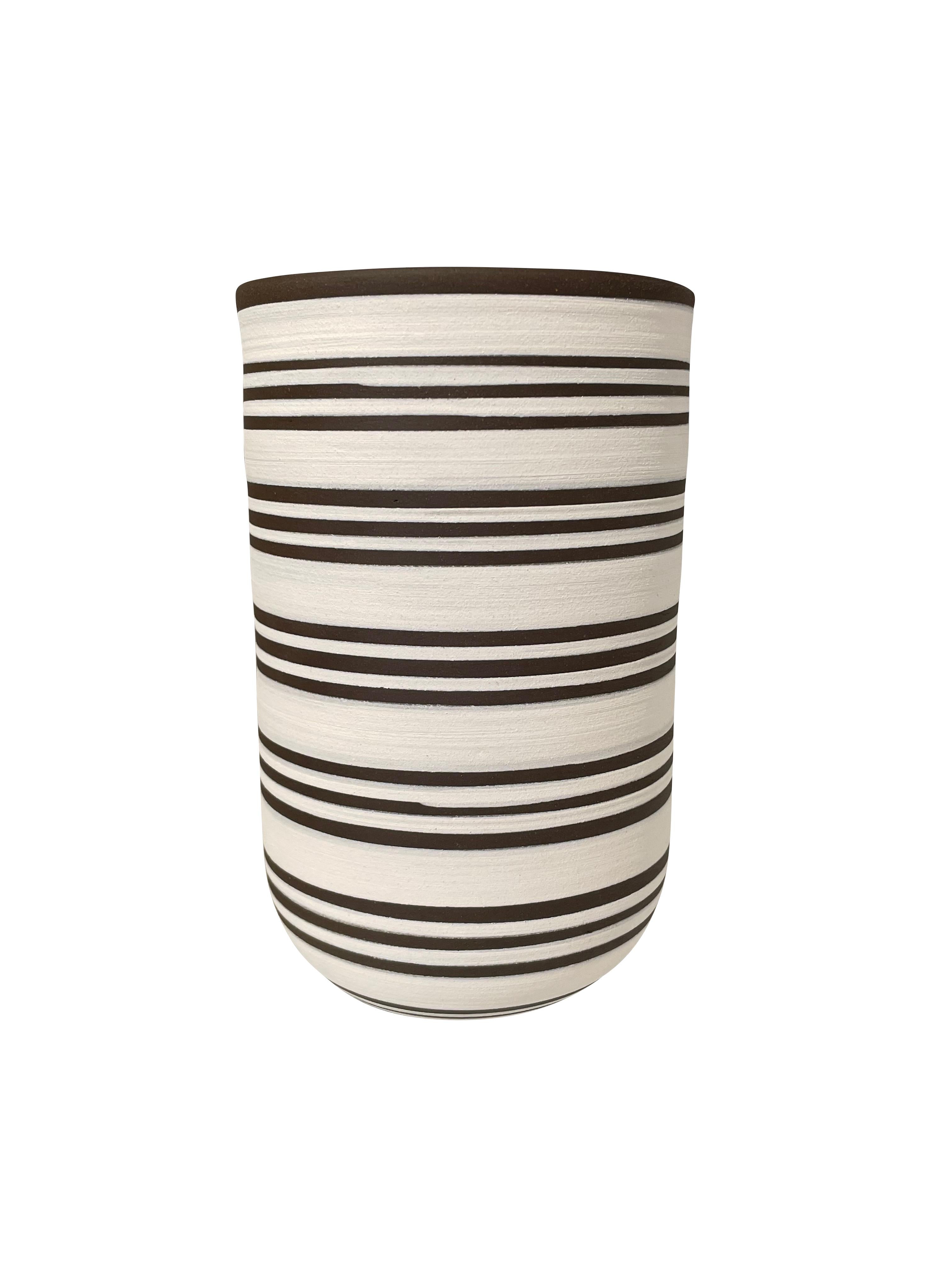 Contemporary Turkish tall white ground ceramic vase with dark brown triple stripes.
Wide mouth opening.
Can hold water.
