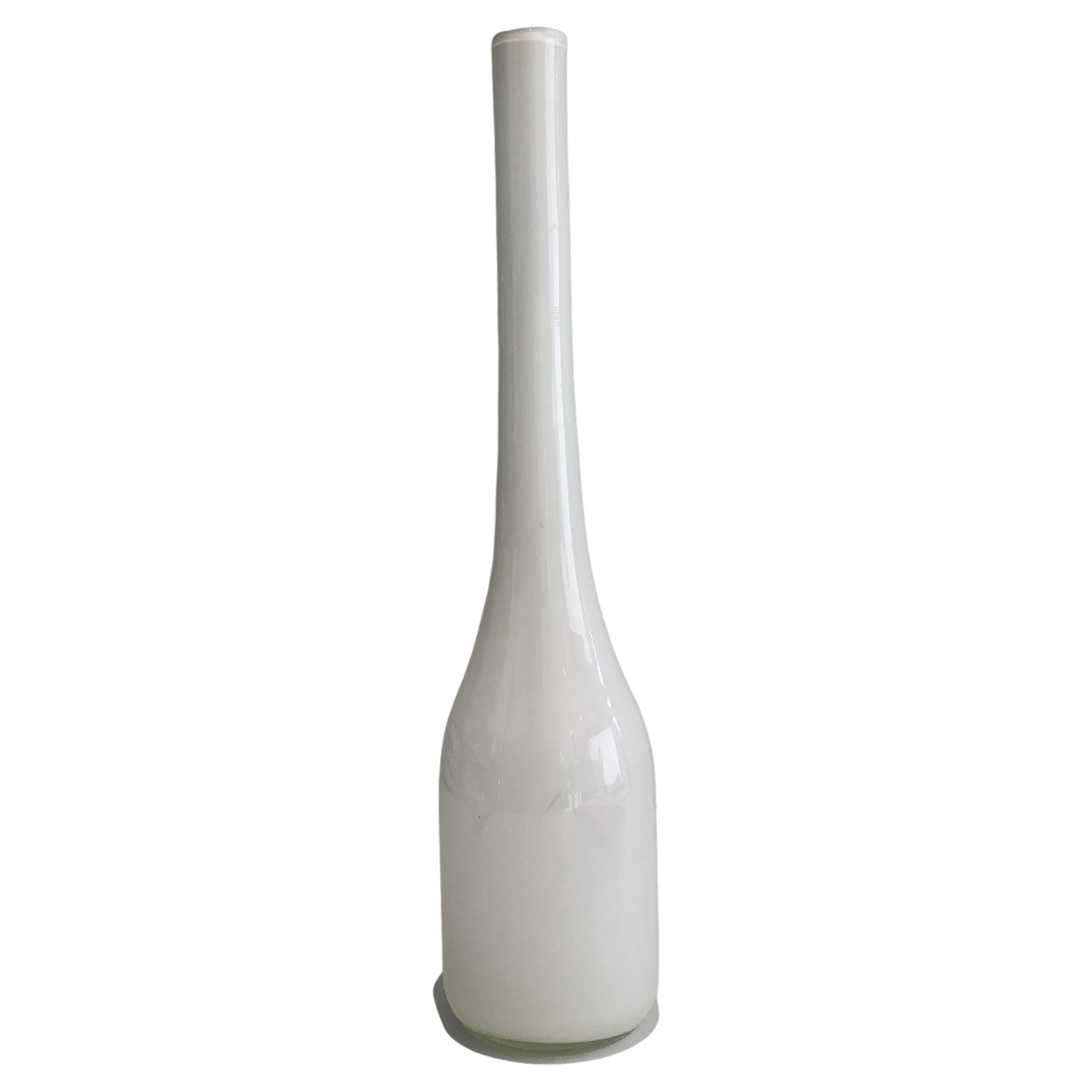 This tall decorative vase is made of white opaline glass. This is a French work. Circa 1970.