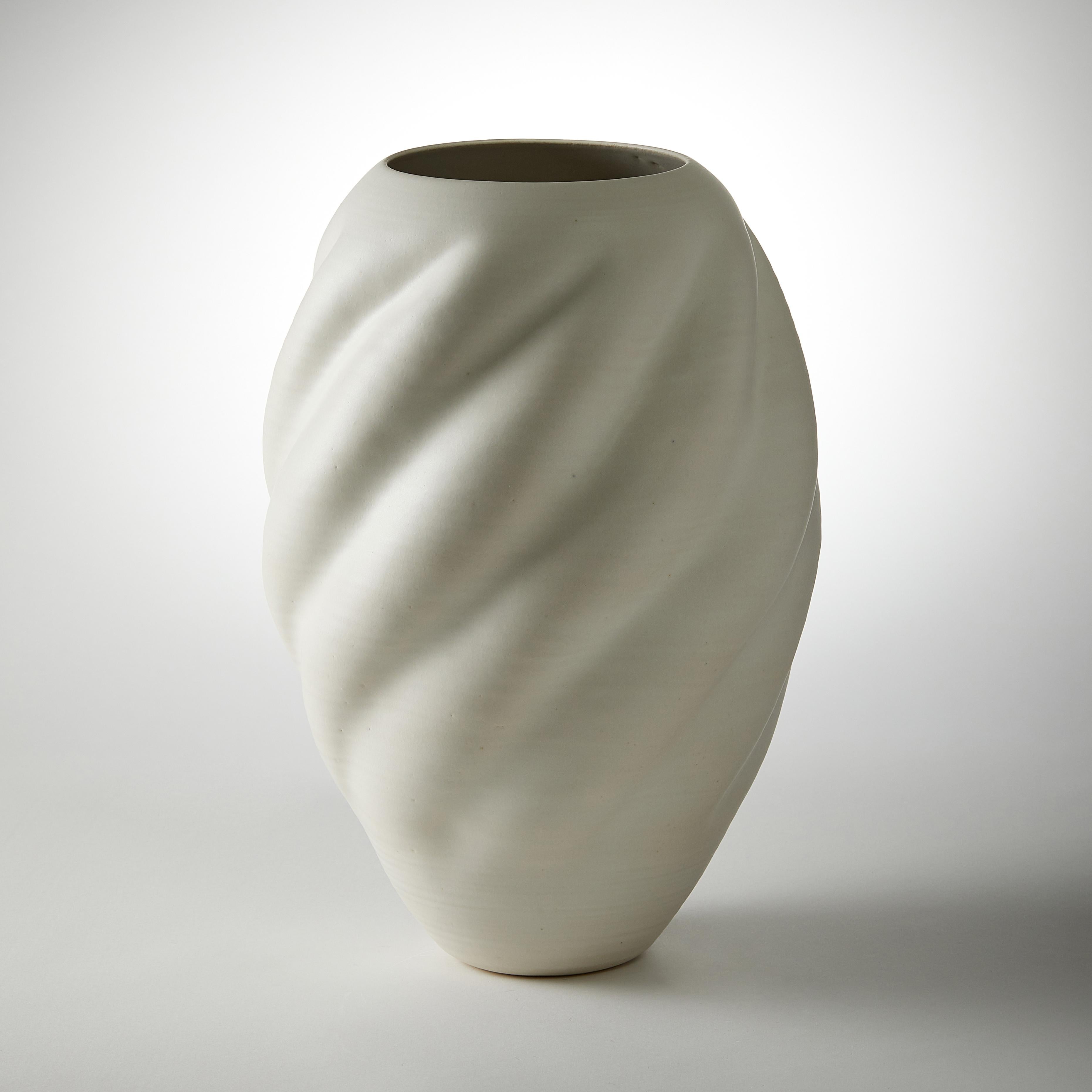 Tall White wave Form No 44 is a unique ceramic sculptural vessel by the British artist Nicholas Arroyave-Portela, made from white St.Thomas clay with stoneware glazes.

Nicholas Arroyave-Portela’s professional ceramic practice began in 1994. After