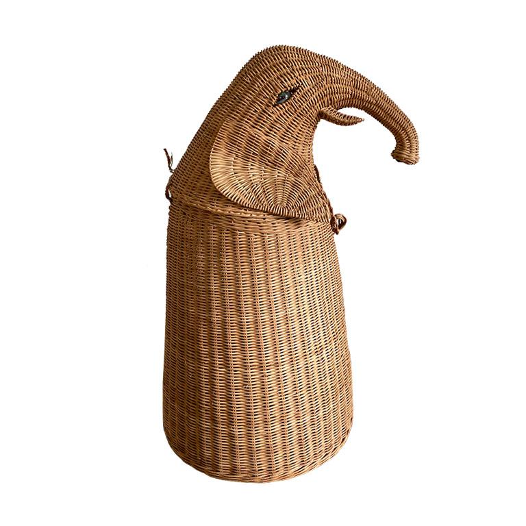 This wicker elephant basket will be a fun way to store blankets or other miscellaneous items. Use it in a children's room, or living room, or patio. 

Standing tall, the elephant's trunk reaches out as though he is about to grab his next meal. The