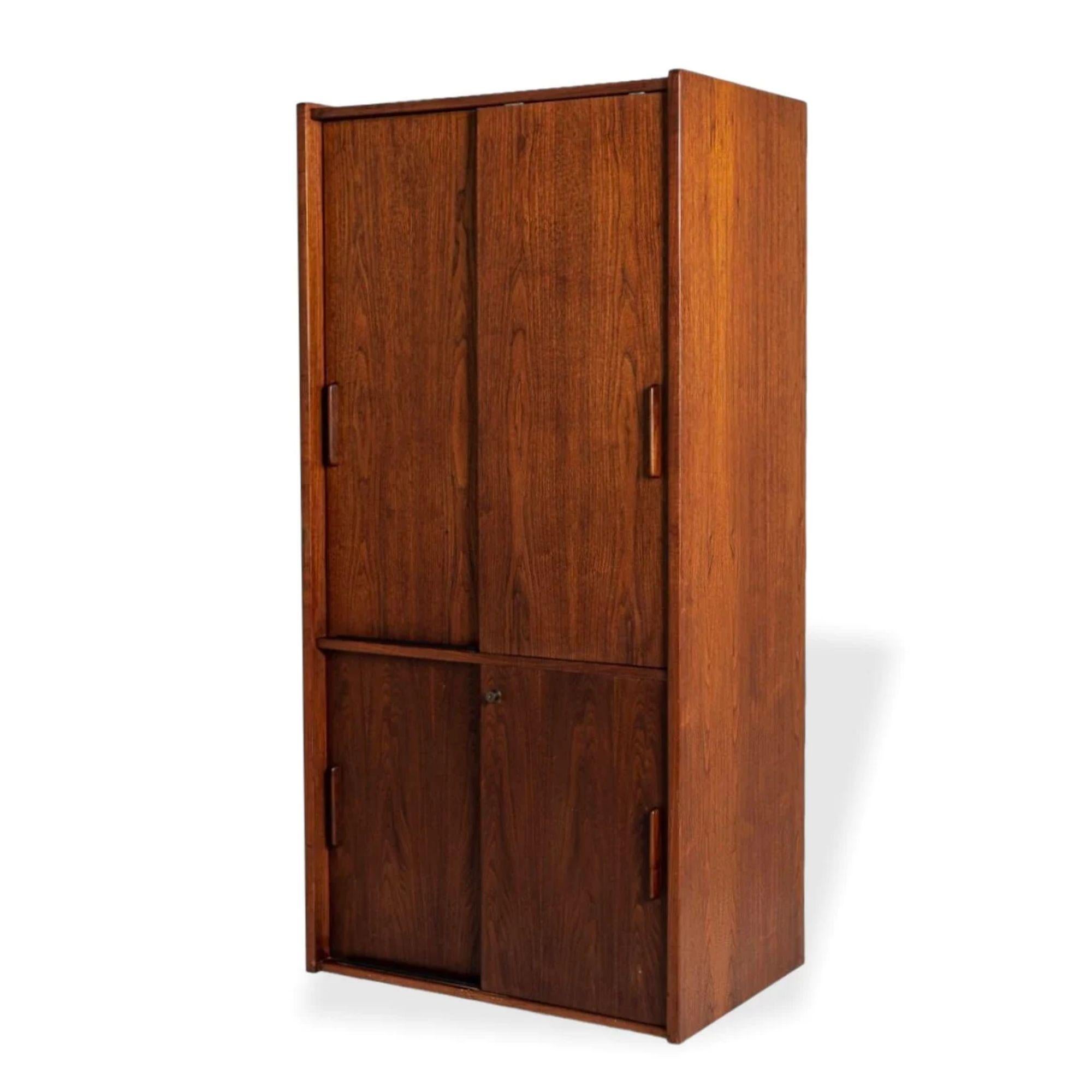 Mid Century Tall Walnut Wood Storage Cabinet or Shelving Unit by Jens Risom

This unique vintage mid century modern tall wooden storage cabinet or enclosed shelving unit by Jens Risom is circa 1960. It is exceptionally well-built from walnut wood