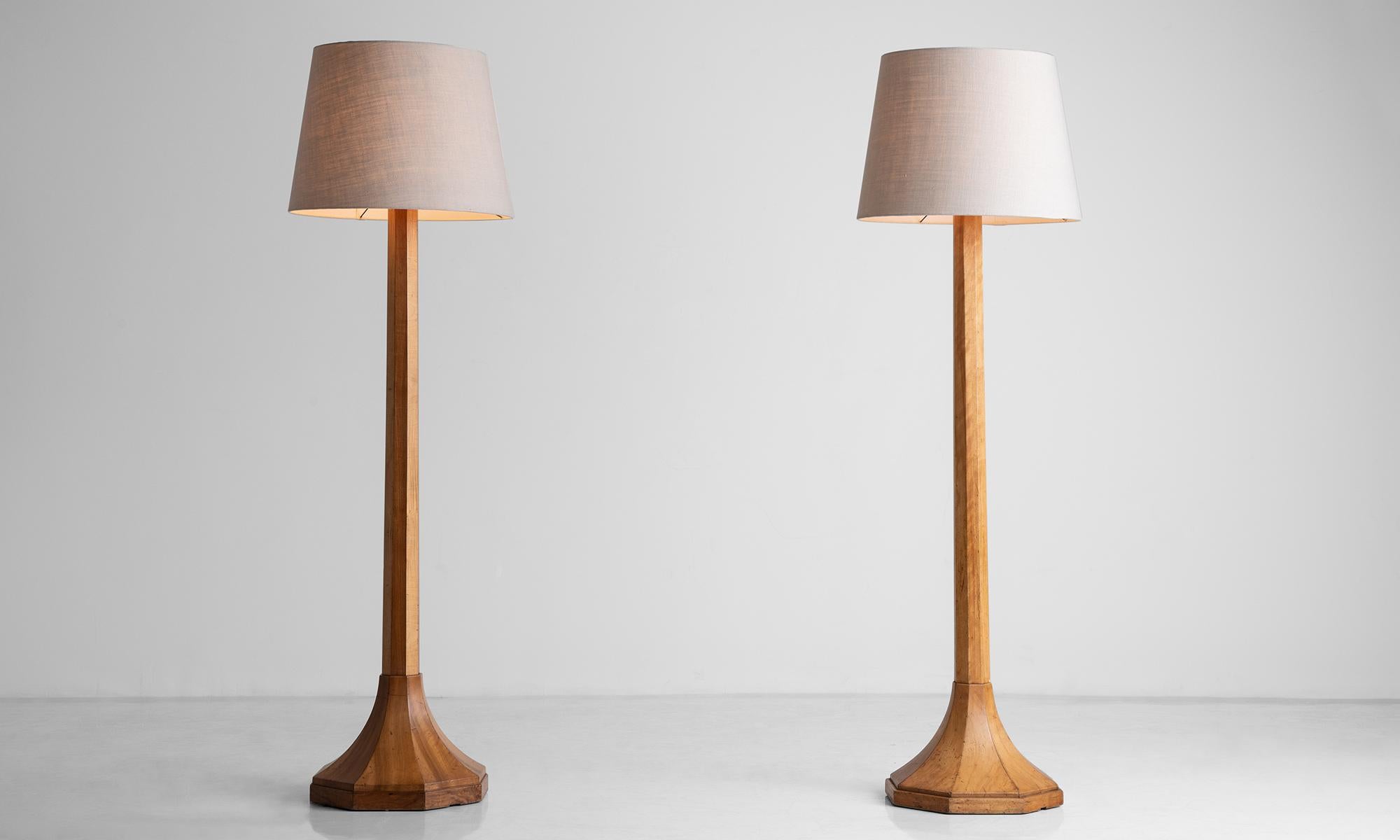 *Please note the price is per unit, and the lamps are sold individually - only one remains*

Tall Wooden floor lamps, 80 inches

England circa 1950

Paneled wooden floor lamps with impressive height, and new shades in natural linen.

Measures: 22.5