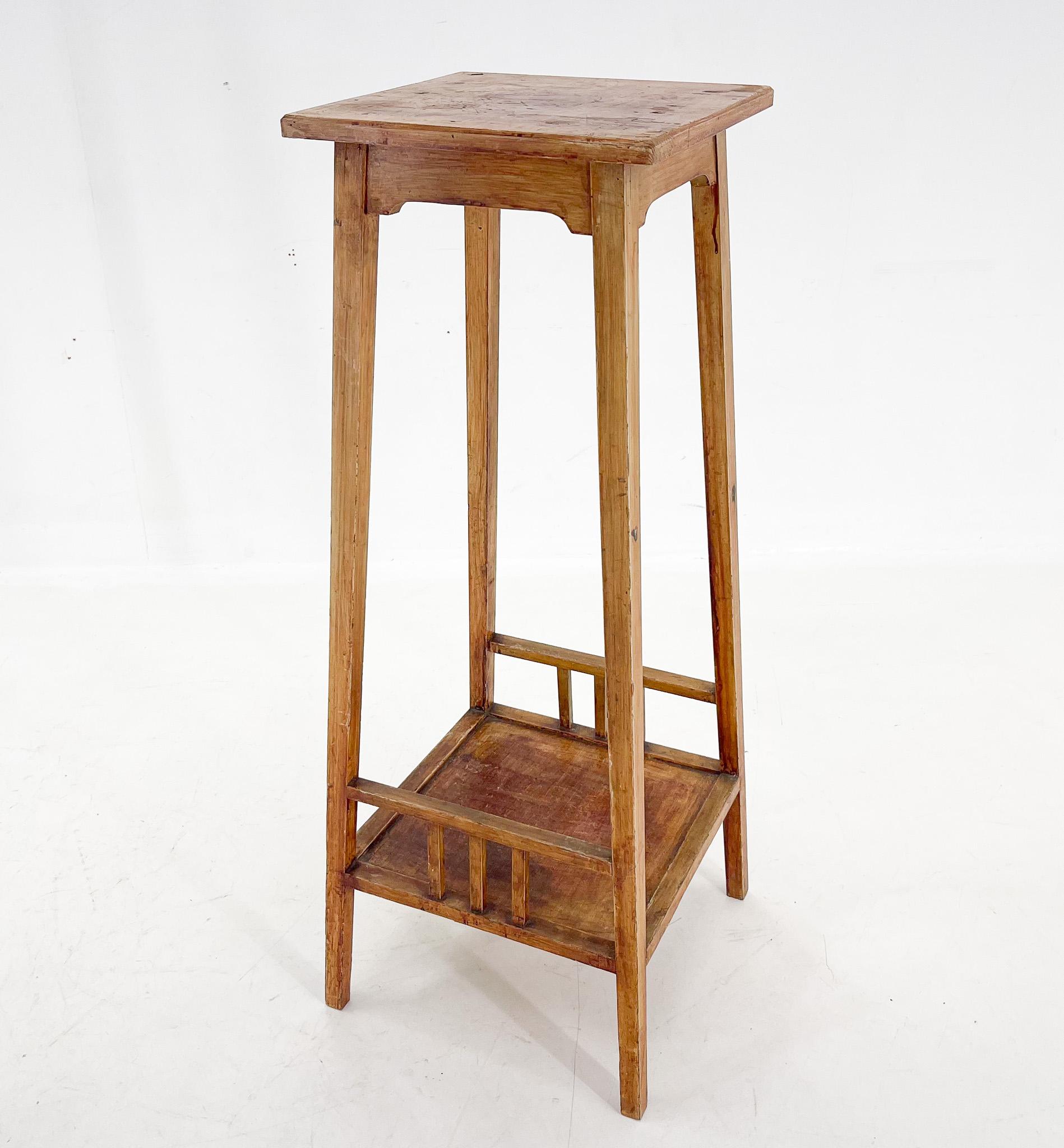 Tall wooden plant stand from the 1930's with original patina. Very stable. The top is approximately 35 cm wide and 35 cm deep.
