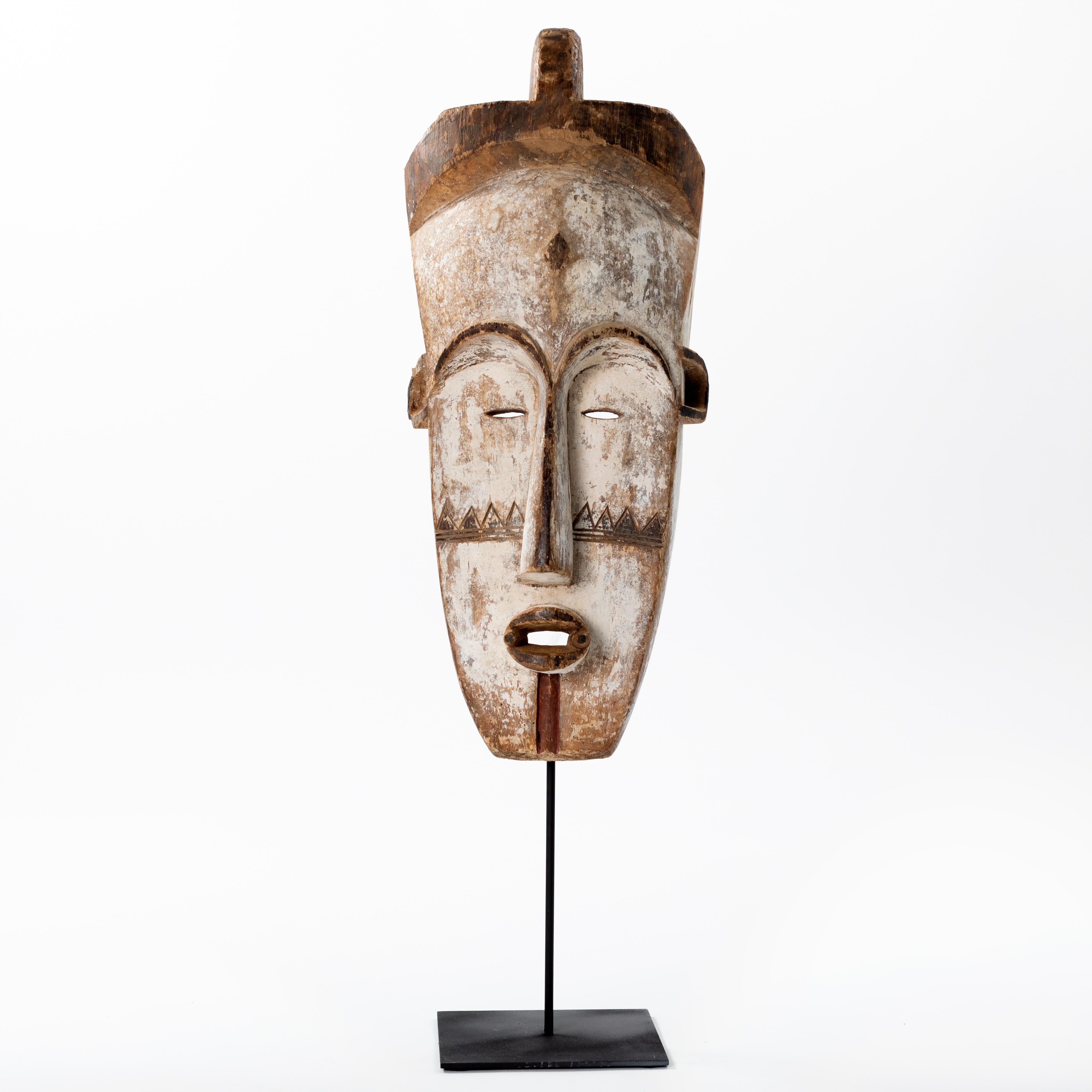 Tall Wooden Tribal Fang Mask of Ngil Brown, Creme and Red Colored Gabon 1970s For Sale 1