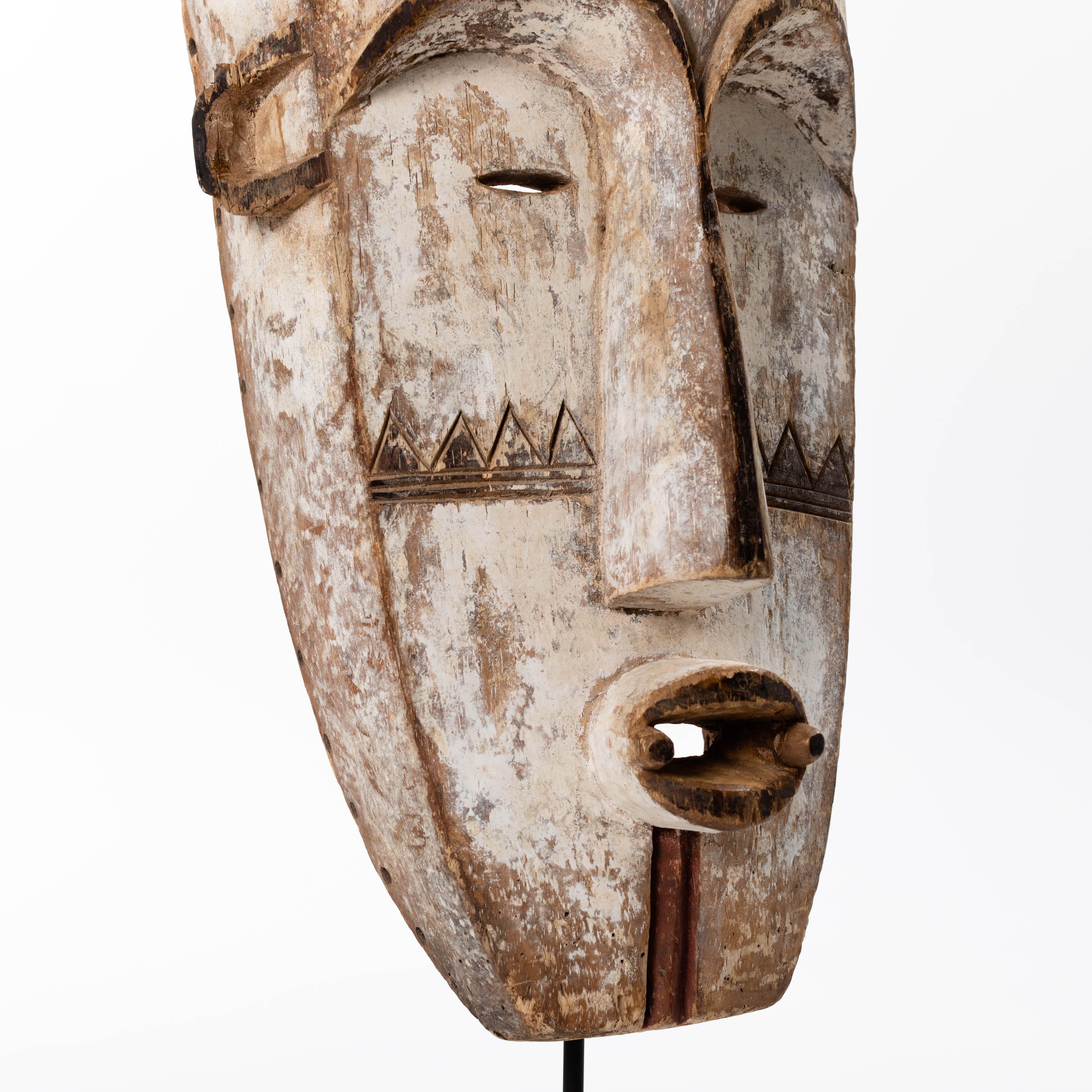 Tall Wooden Tribal Fang Mask of Ngil Brown, Creme and Red Colored Gabon 1970s For Sale 10