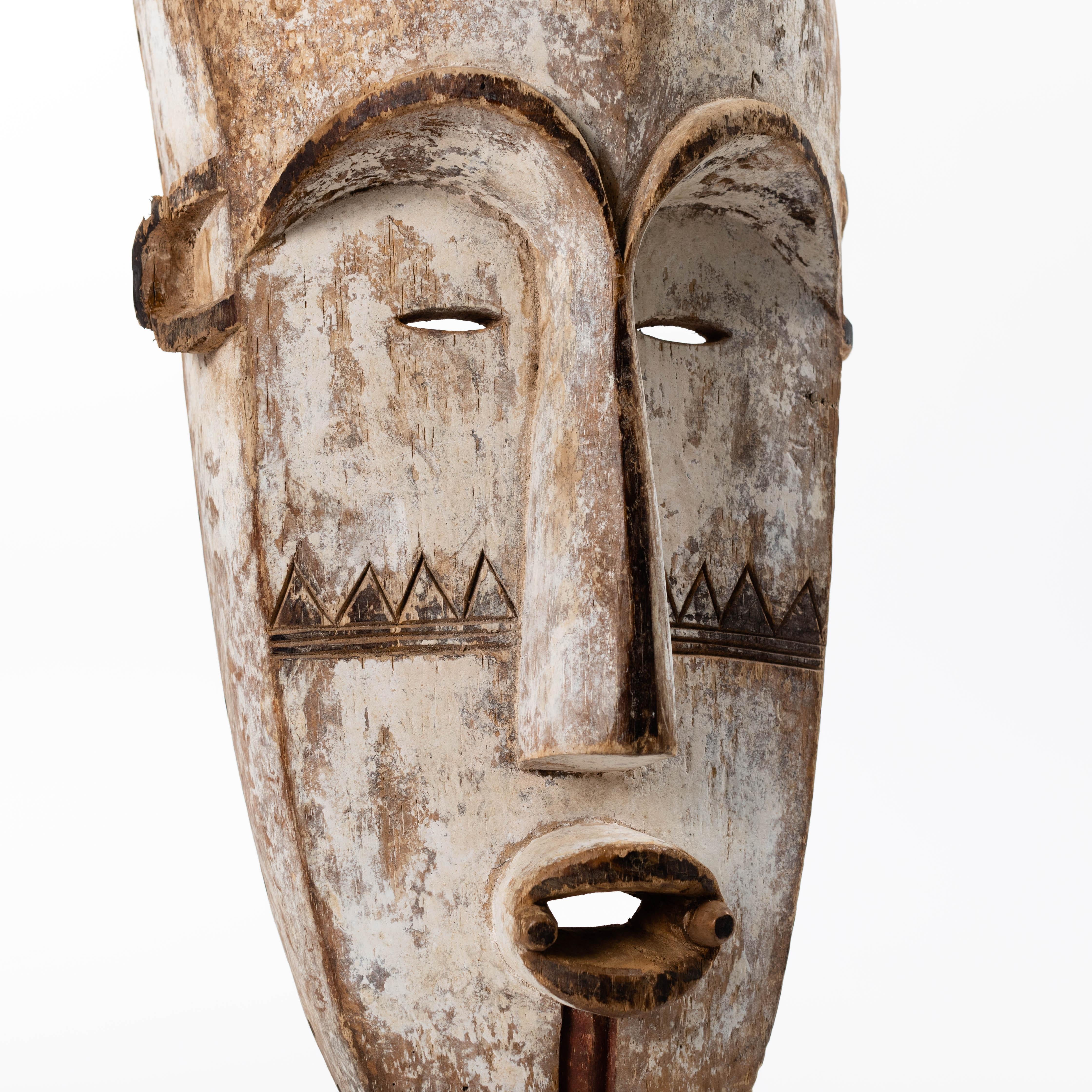 Tall Wooden Tribal Fang Mask of Ngil Brown, Creme and Red Colored Gabon 1970s For Sale 11
