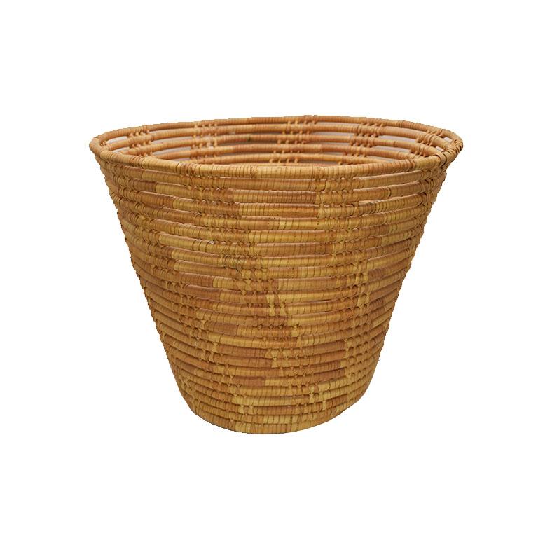 A tall woven basket made from natural fibers. A fabulous way to store miscellaneous items such as remotes or other pieces that need to be tucked away. 

Dimensions:
9.5