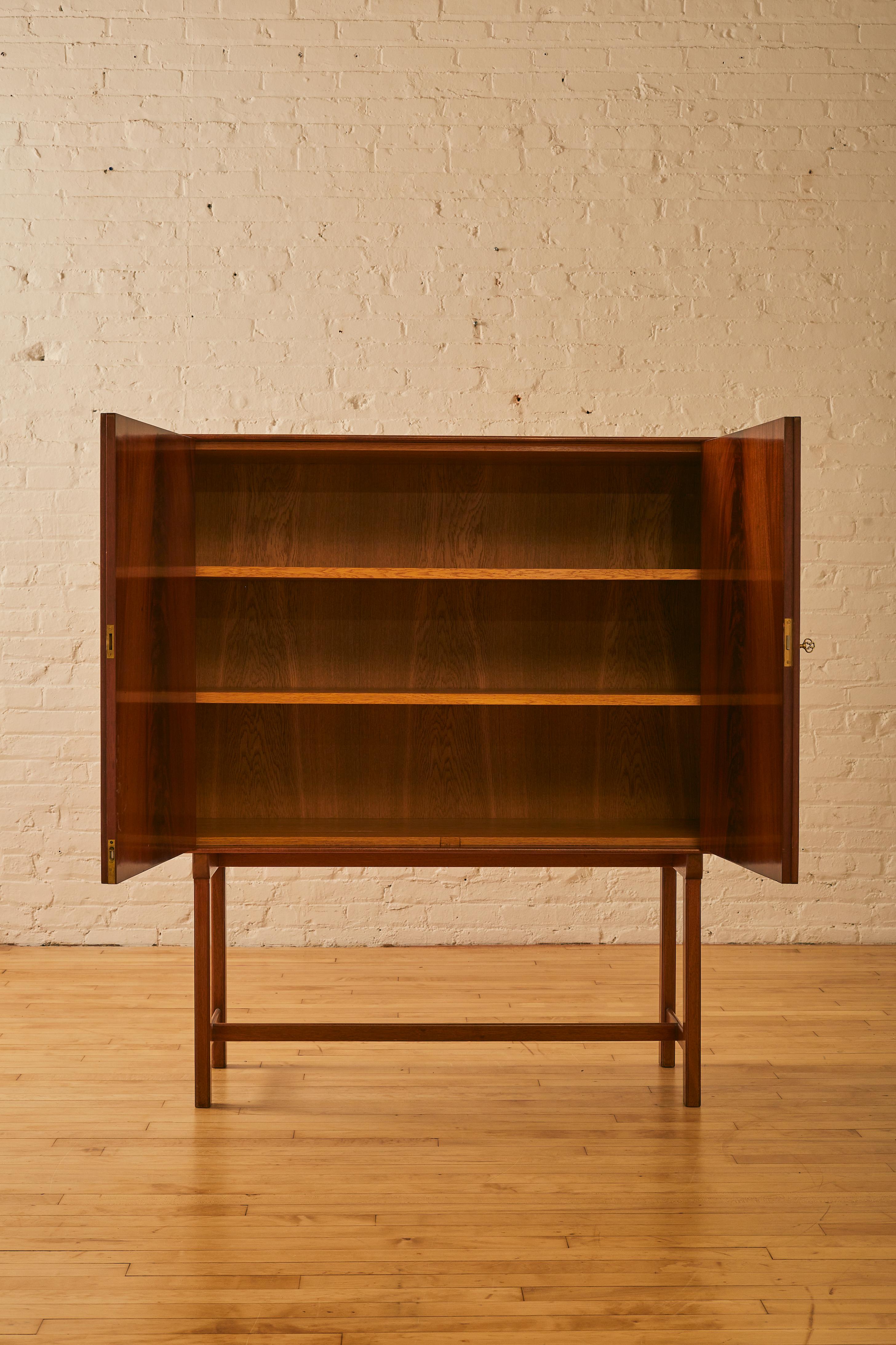 Tallboy Cabinet by Josef Frank ( Model 955 ) in mahogany with a brass key and joinery. 

About Josef Frank:

Josef Frank was one of early Vienna modernism’s foremost figures, but already in the beginning of the 1920s he started to question