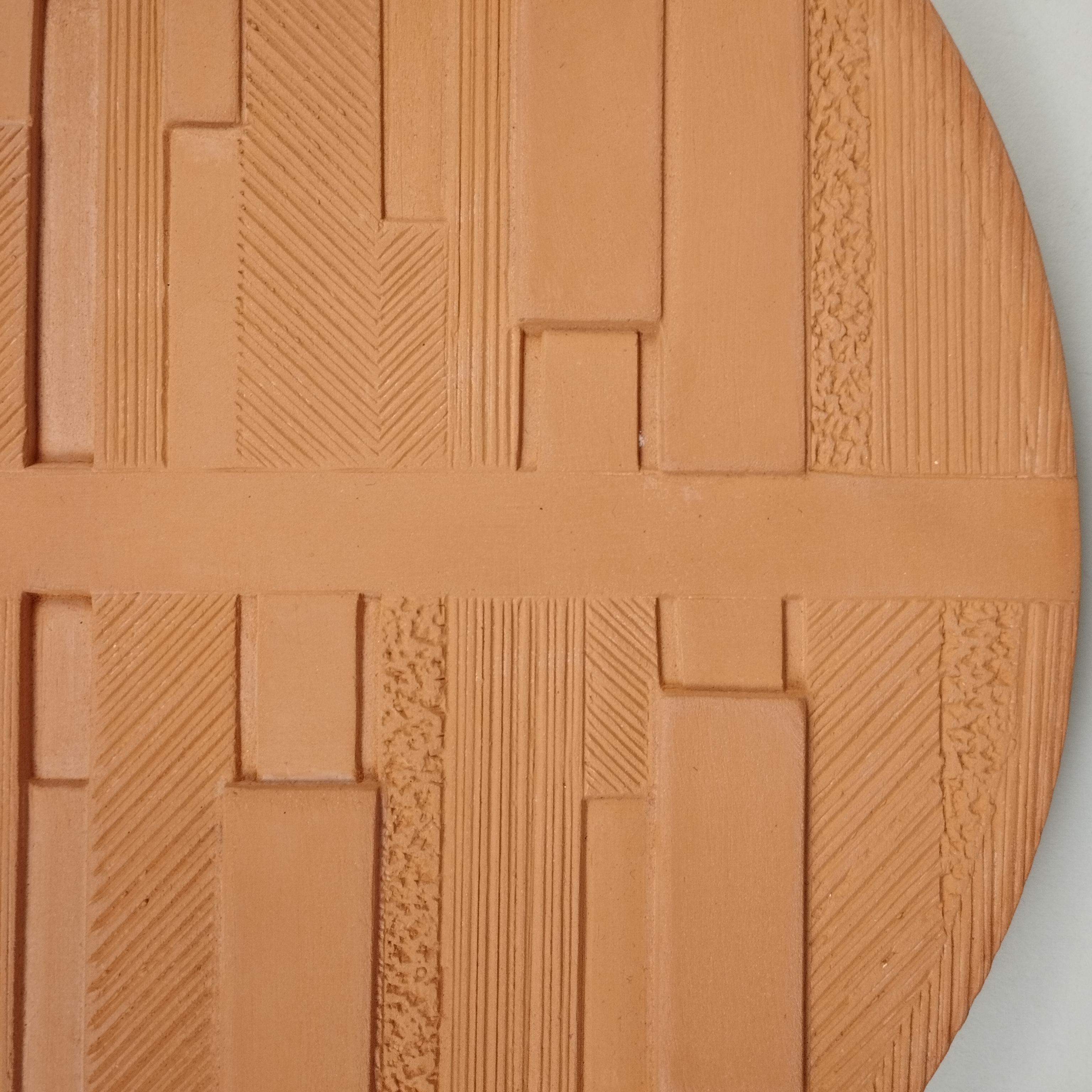An oval geometric clay table sculpture by TALLER Mauricio Rocha + Gabriela Carrillo. This is an edition of 25 sets casted by Cerámica La Mejor, Mexico City, 2019.

The ceramic relief panel they created for this series reflects their focus on