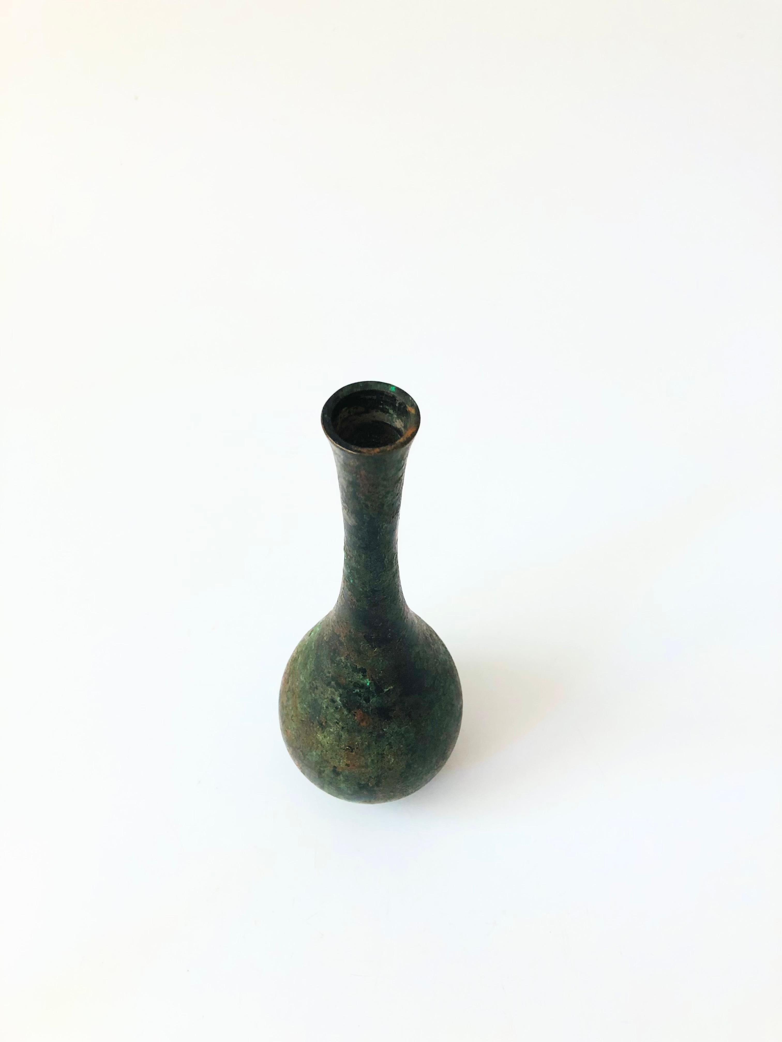 A vintage Japanese Takaoka Doki verdigris bronze vase. Beautiful variation between the green and bronze organic patinated finish.


