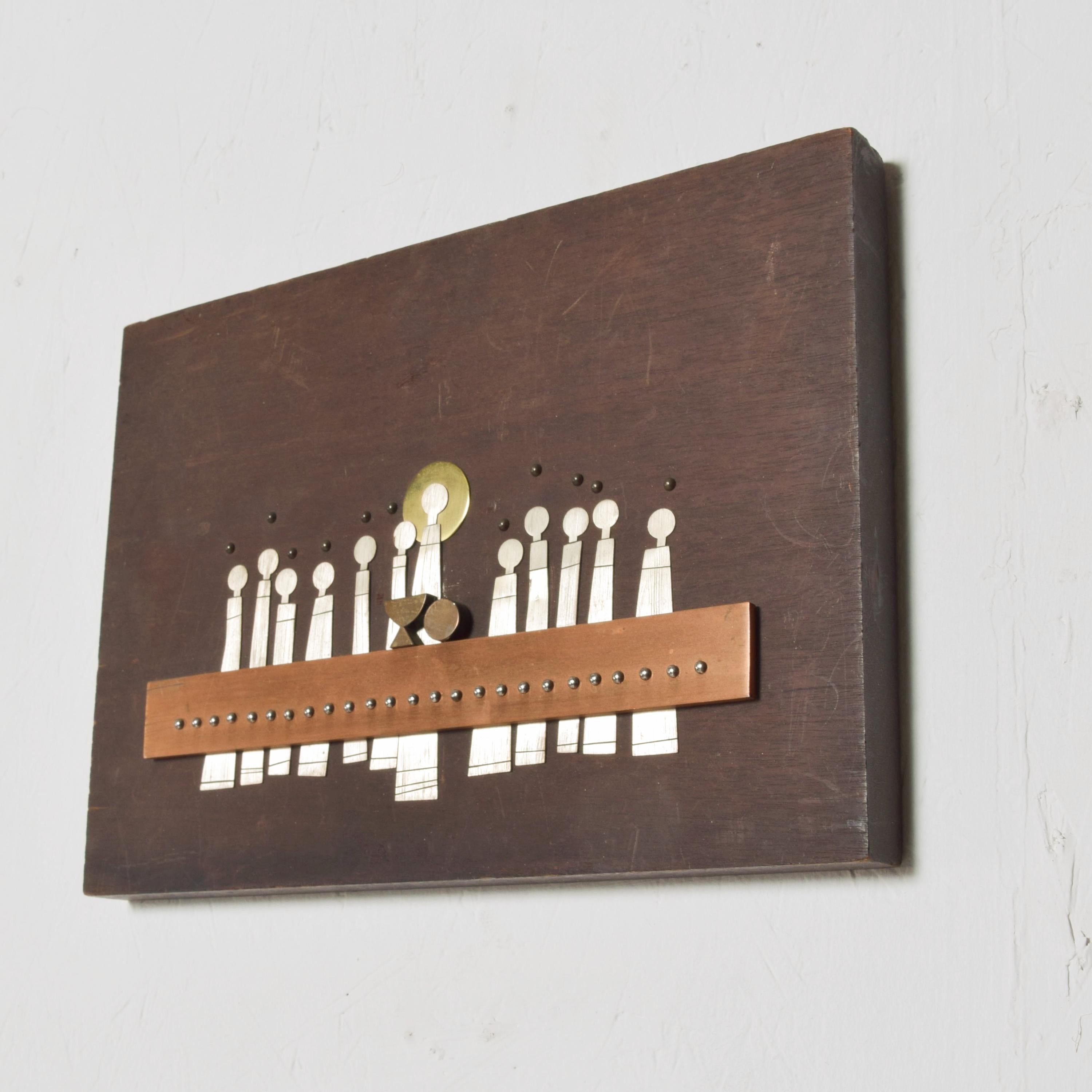 By Talleres Monasticos Last Supper religious plaque in solid mahogany. Made in Mexico, 1970s.
Talleres Monasticos is the workshop for the Emaus Benedictine Monks in Cuernavaca, Mexico
 Depicted is a modernist interpretation of the Last Supper.