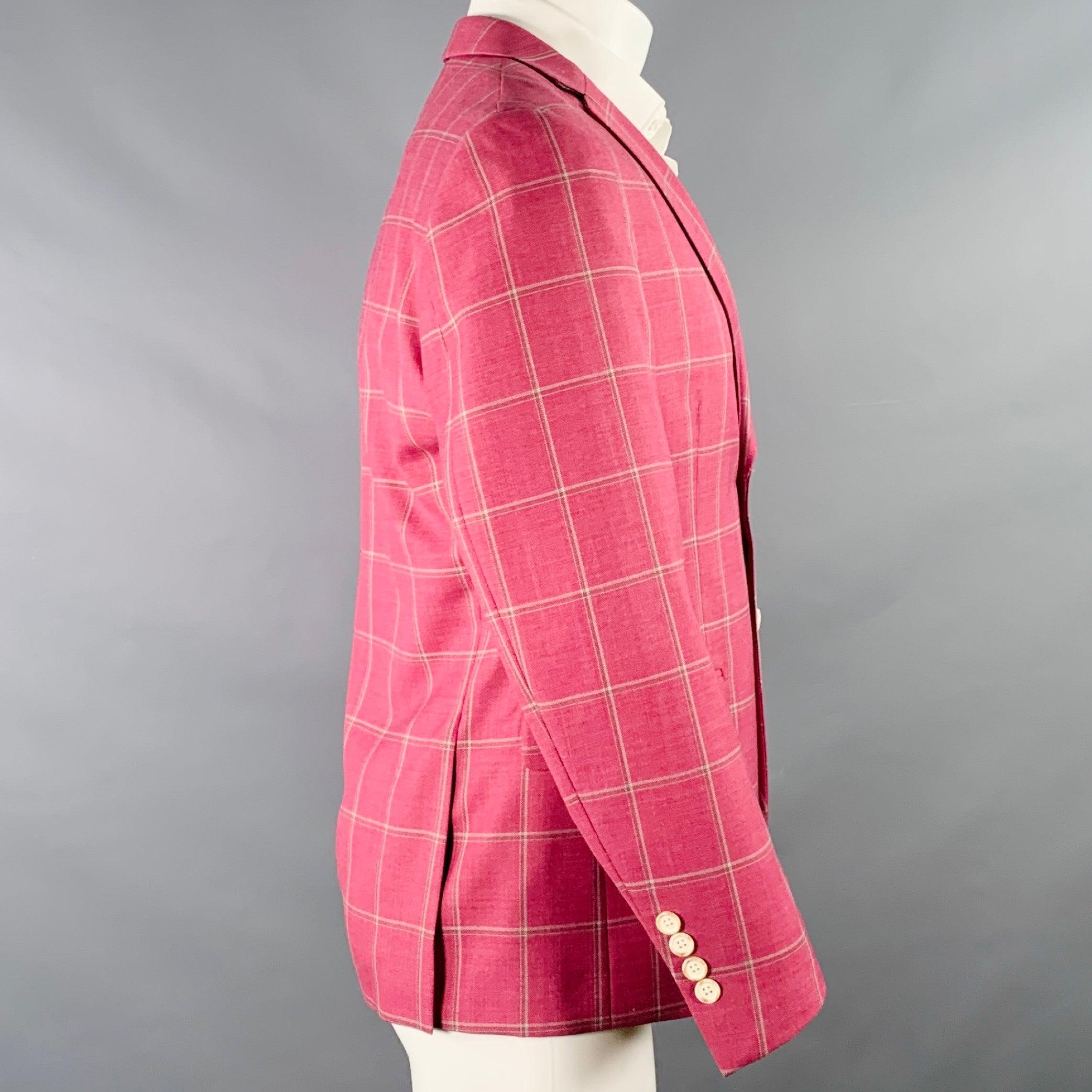 TALLIA sport coat
in a raspberry wool blend fabric with full butterfly lining featuring white windowpane pattern, notch lapel, double vented back, and double button closure. Excellent Pre-Owned Condition. 

Marked:   38S 

Measurements: 
 
Shoulder: