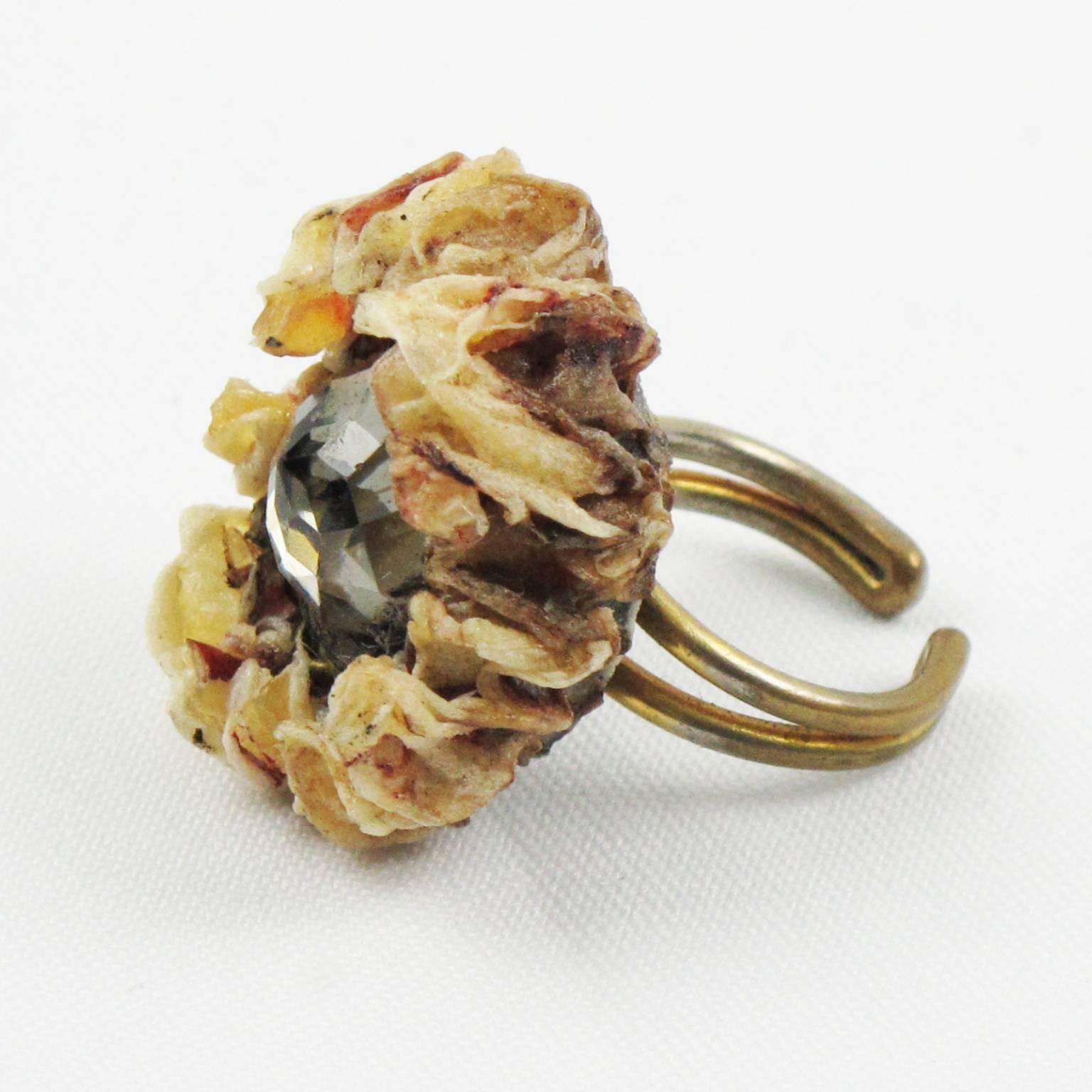 Rare Talosel Ring executed by one of the students of Line Vautrin. Brown-beige talosel resin floral shape, encrusted with huge faceted glass cabochon in silver-gray color. Double gilt metal band, opened at the back for adjustable flexibility (one