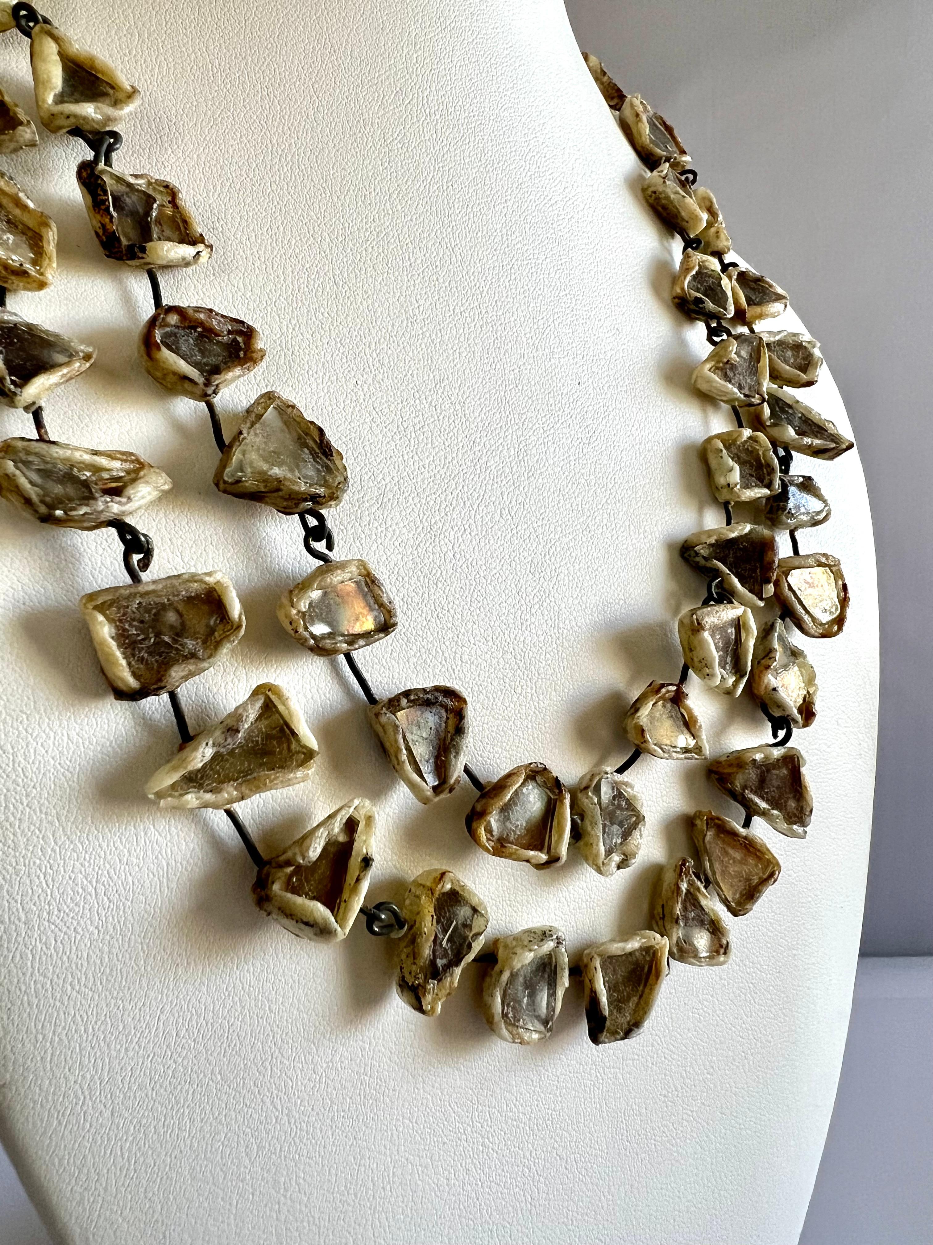 Spectacular necklace in delicate golden bronze mirrored fragments, all set in cream colored 'talousel',  French resin, by Line Vautrin - made in France circa 1960s.


