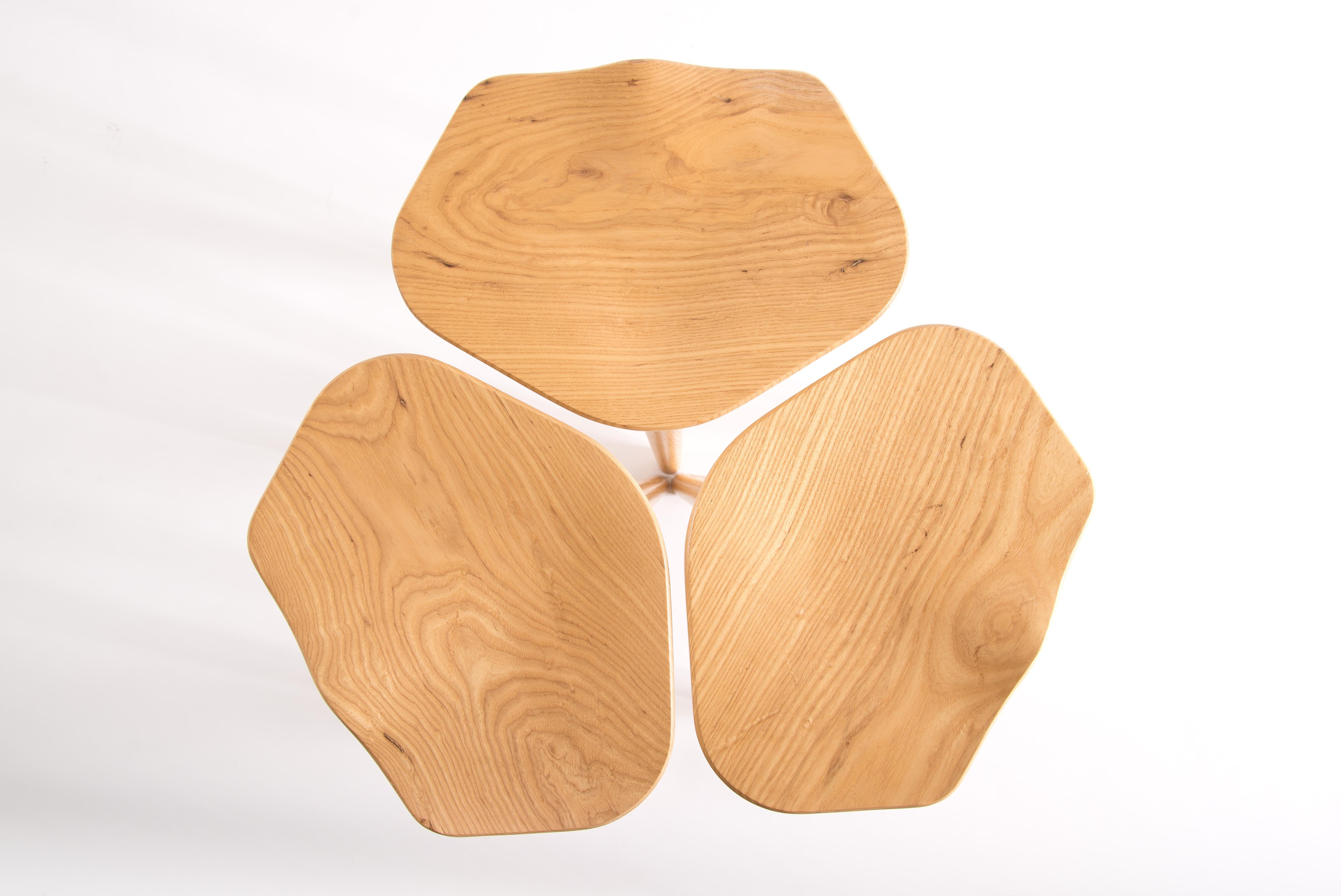 A sculptural clover or three stools: tam is both of those things. Like leaves that blow in the wind, the individual stools can land dispersed throughout the house, or they can stay together as a clover, for good luck. As light shines on the tam