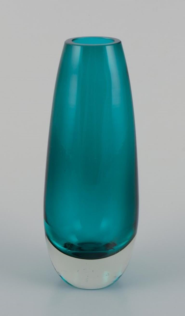 Tamara Aladin (1932-2019) for Riihimäen Lasi, Finland. 
Art glass vase in turquoise.
Model 1440.
1960s.
Marked.
Perfect condition.
Dimensions: H 16.0 cm x D 6.0 cm.
