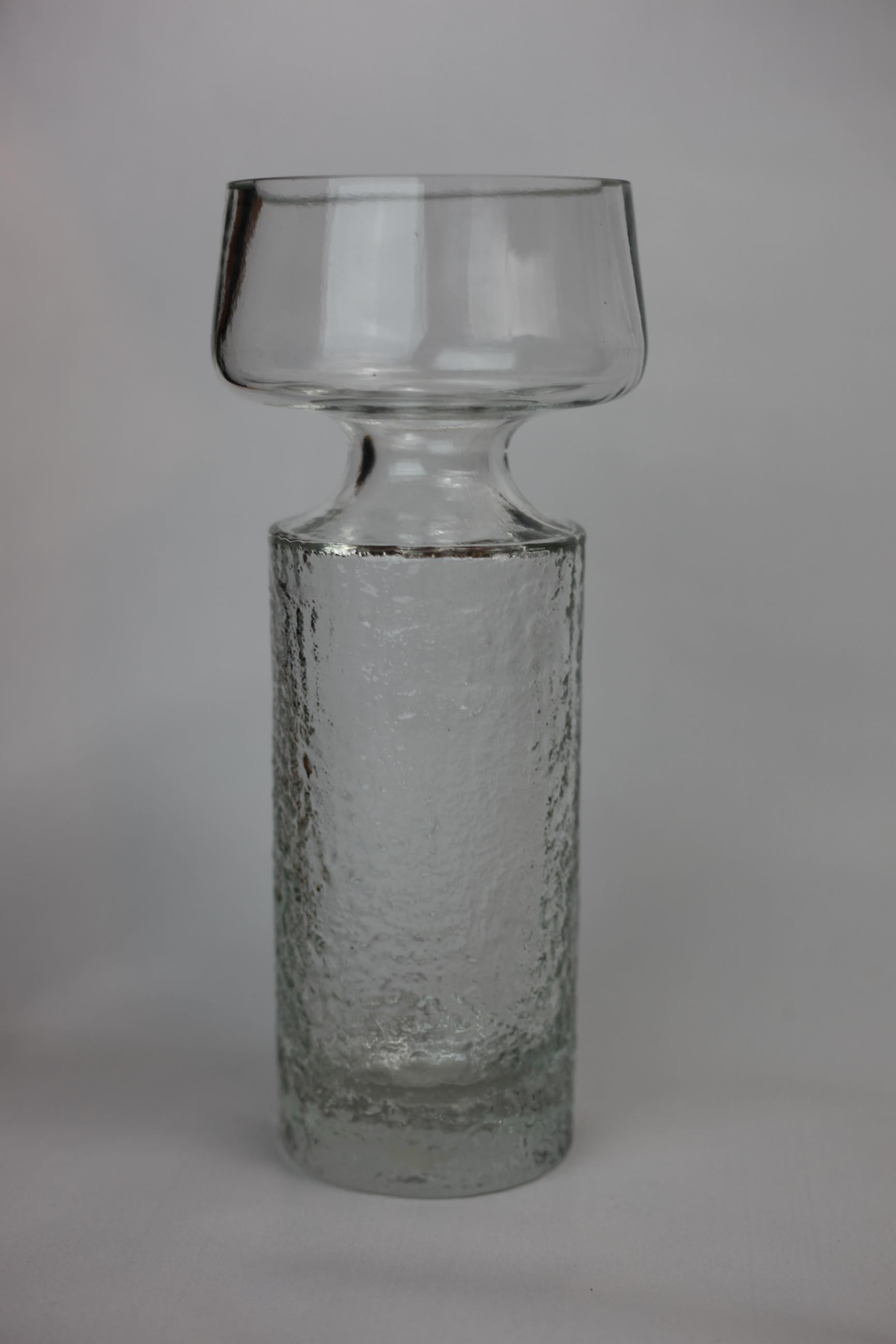 Exquisite Frosted mold blown Riihimäen Lasi Safari vase by Tamara Aladin for Riihimäen Lasi or Riihimaki of Finland. Ice clear top and frosted textured bottom.
This heavy glass Vase, model # 1495 was produced from 1968 to 1974. In very good