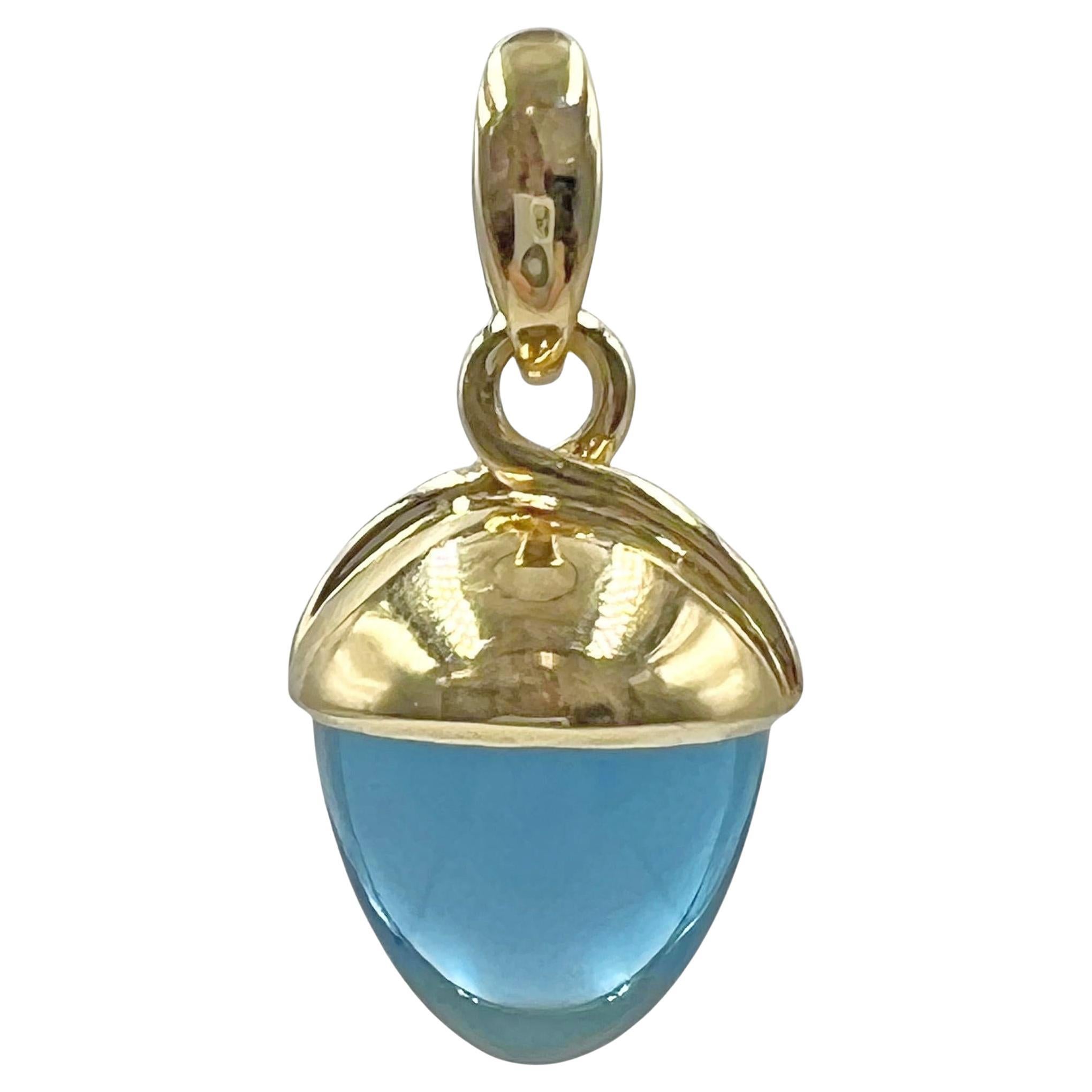 The iconic Mikado Flamenco pendant by Tamara Comolli in 18k yellow gold and blue topaz. This large size version of the Mikado pendant features a beautiful blue topaz in the classic acorn shape. Measuring 1.5 inches in length (including the bail). 