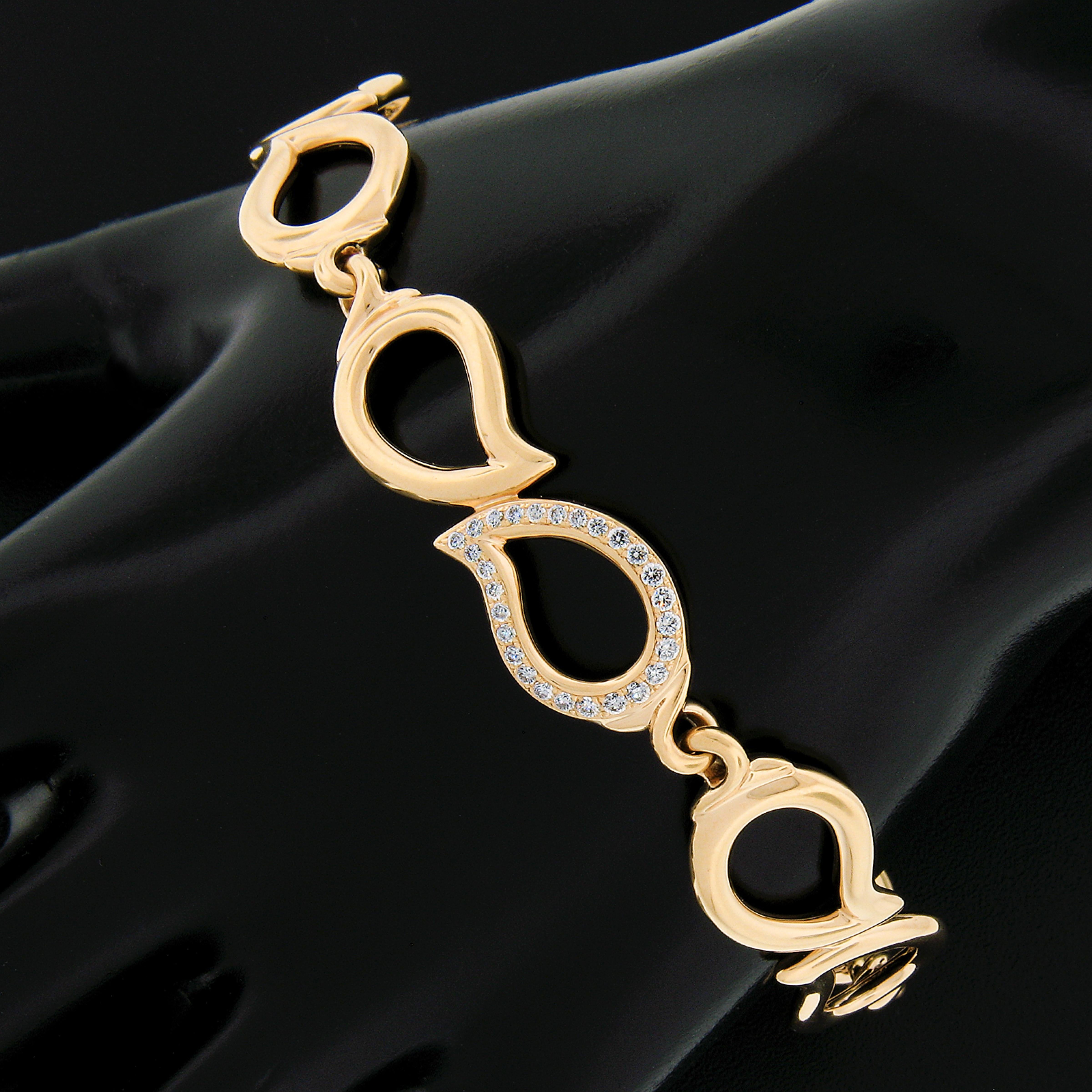 You are looking at a very lovely link bracelet by Tamara Comolli crafted in solid 18k rosy yellow gold. This bracelet features open work leaf links that are high polished with the center leaf being adorned with 0.31 carats of the finest quality